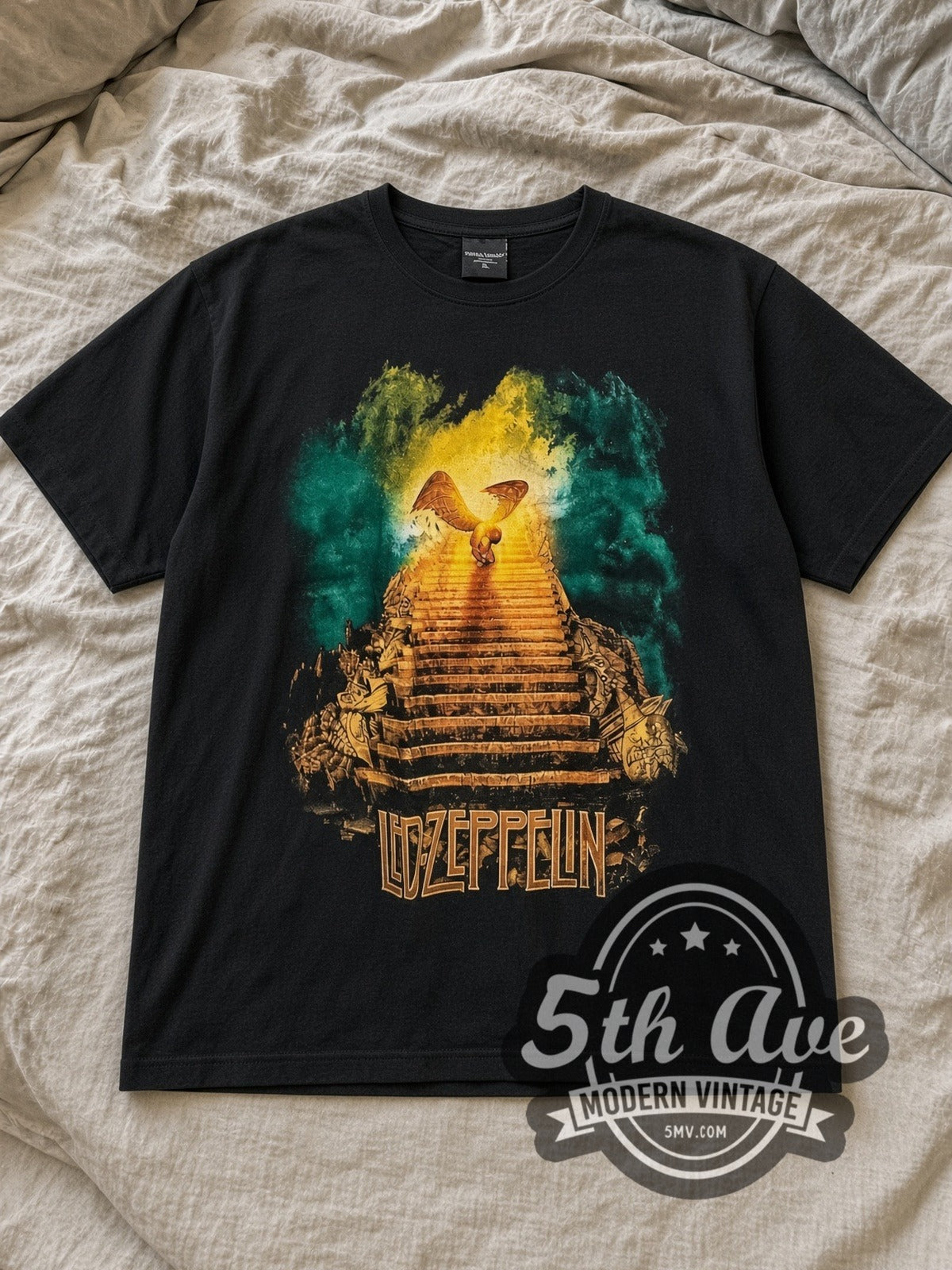 Black Led Zeppelin Stairway Sunset Vintage Band T-Shirt laid flat on a linen bed