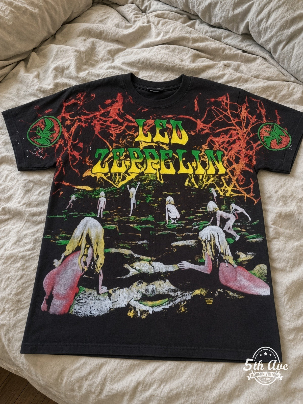 Led Zeppelin Houses of the Holy all over print vintage tee laid on bed