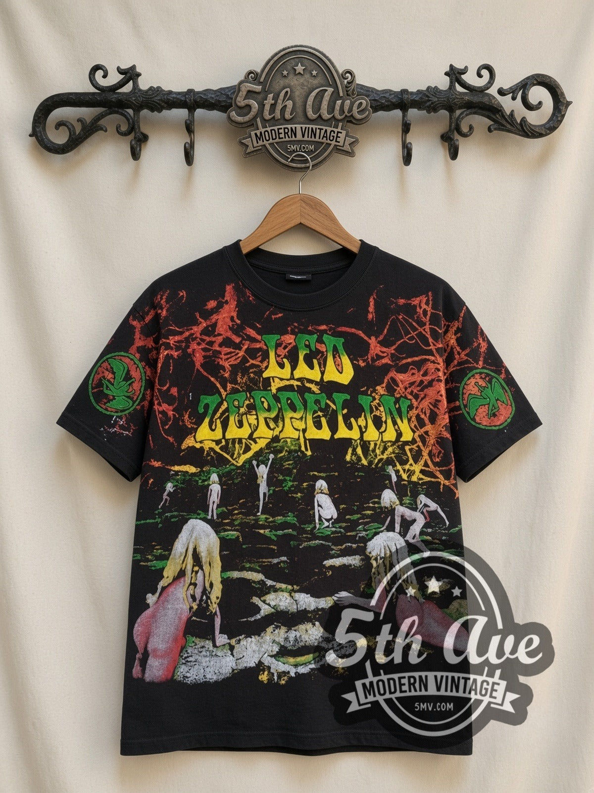 Led Zeppelin Houses of the Holy all-over-print vintage band t-shirt in black, front view on a display rack