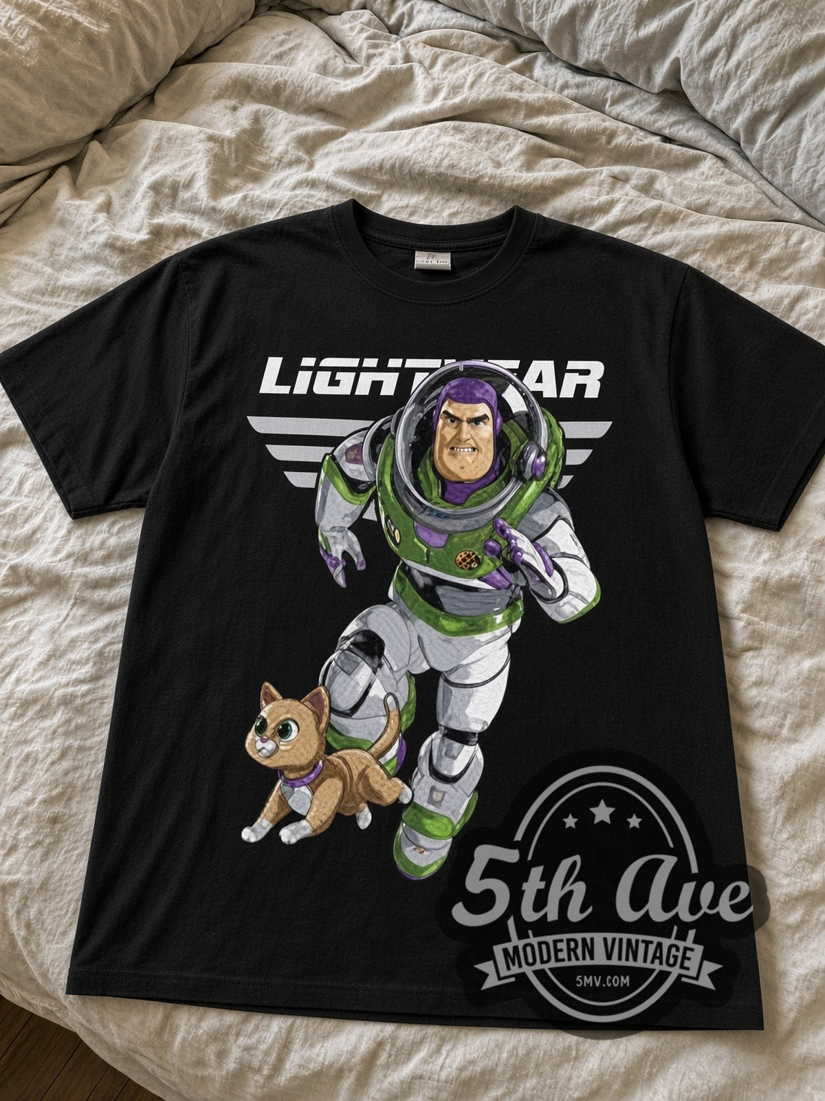 Lightyear Buzz and Sox black graphic tee laid flat on linen bed