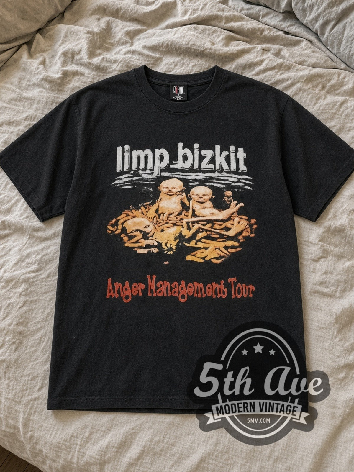 Black Limp Bizkit Anger Management Green Leaf Eminem Papa Roach Vintage Band T-Shirt laid flat on a linen bed