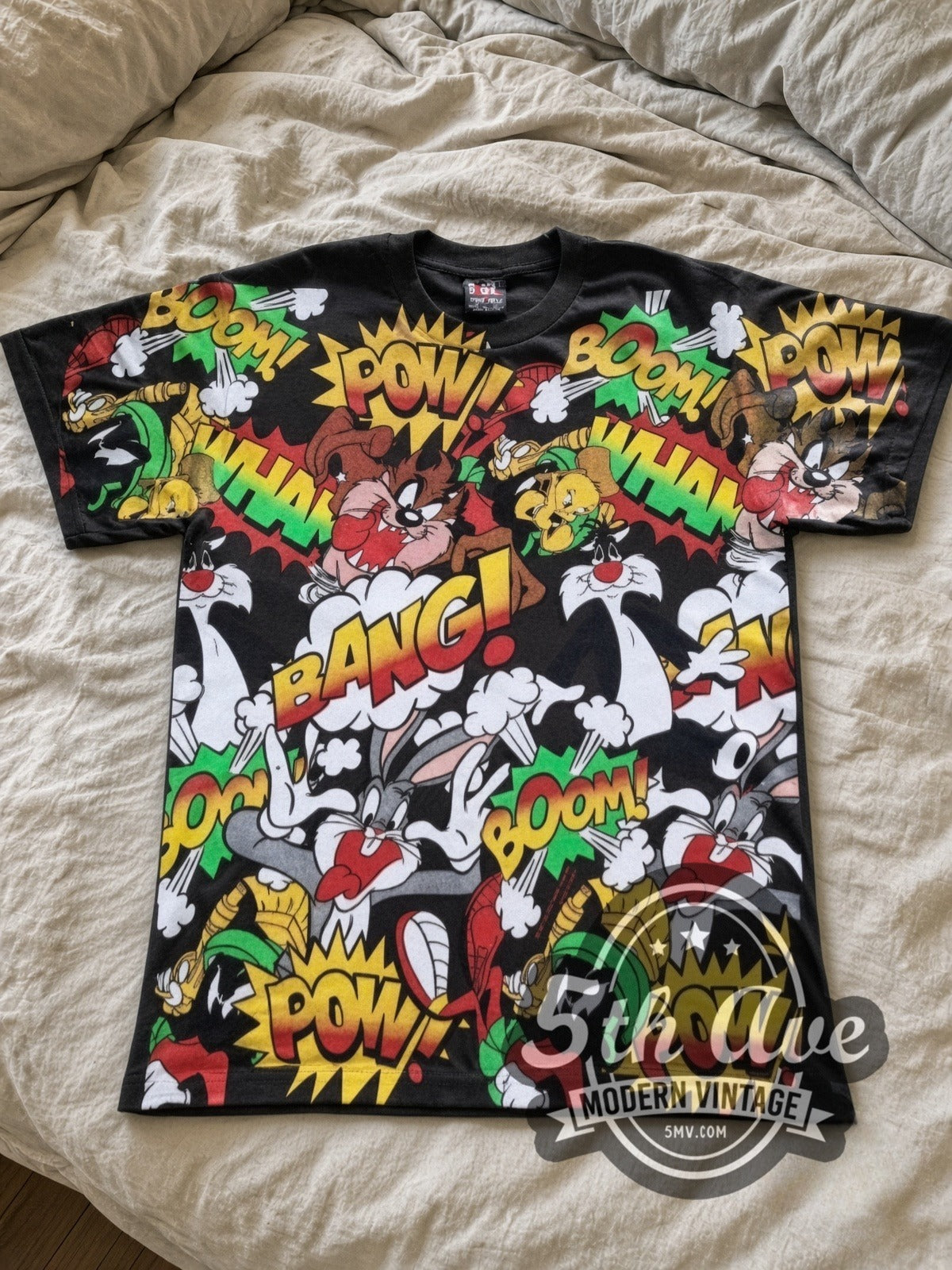 Looney Tunes Comic POW BANG Action Collage all-over-print vintage cartoon tee in black laid flat