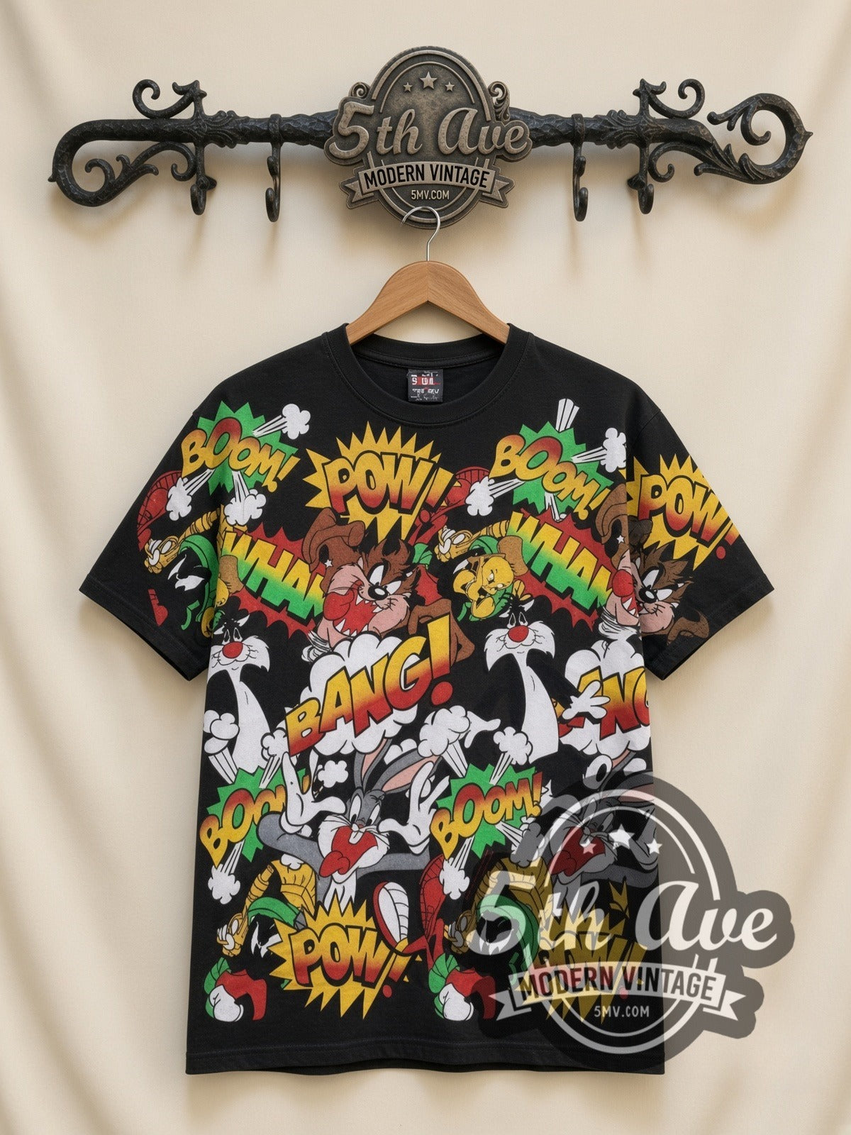 Looney Tunes Comic POW BANG Action Collage all-over-print vintage cartoon t-shirt in black, front view on a display rack