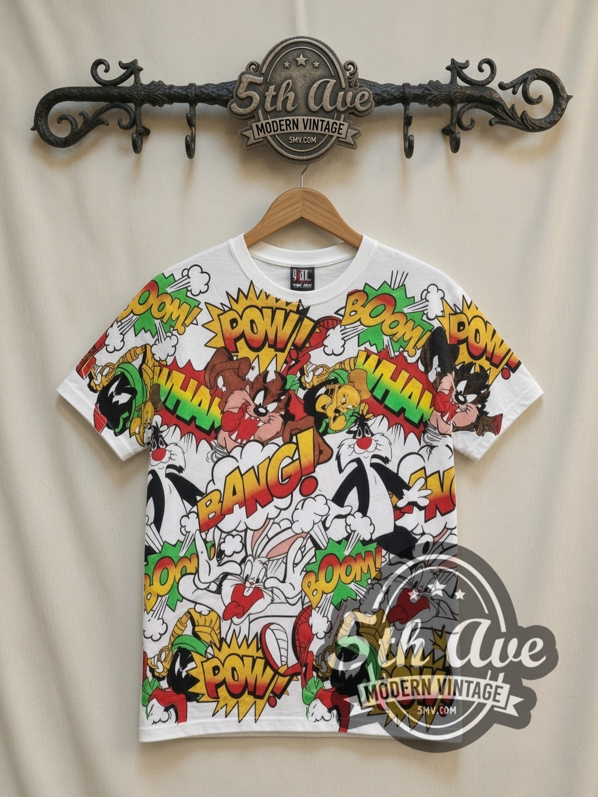 Looney Tunes Comic POW BANG Action Collage all-over-print vintage cartoon t-shirt in white, front view on a display rack