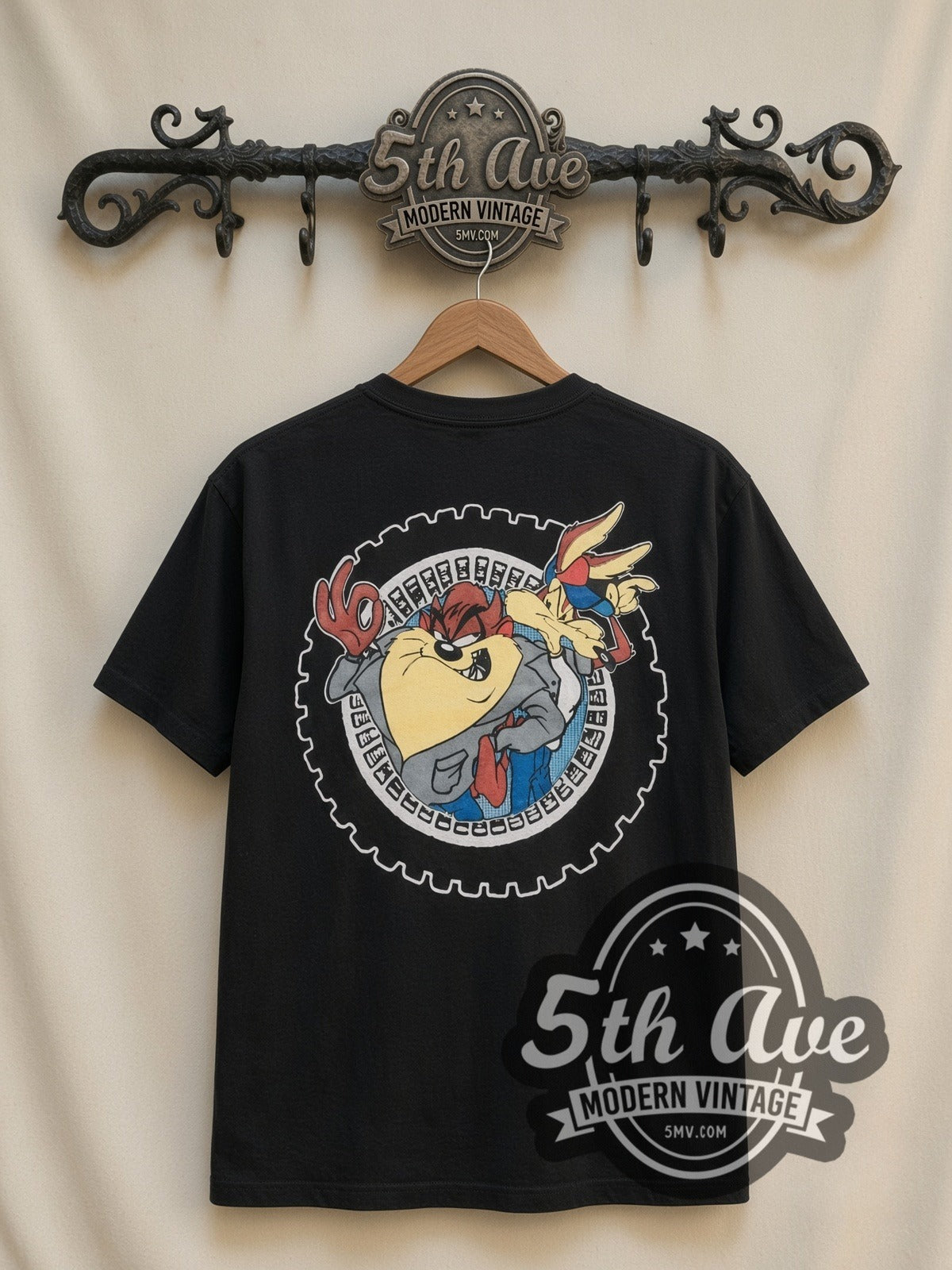 Looney Tunes Cool Riders Taz & Wile E all-over-print vintage cartoon t-shirt in black, back view on a display rack