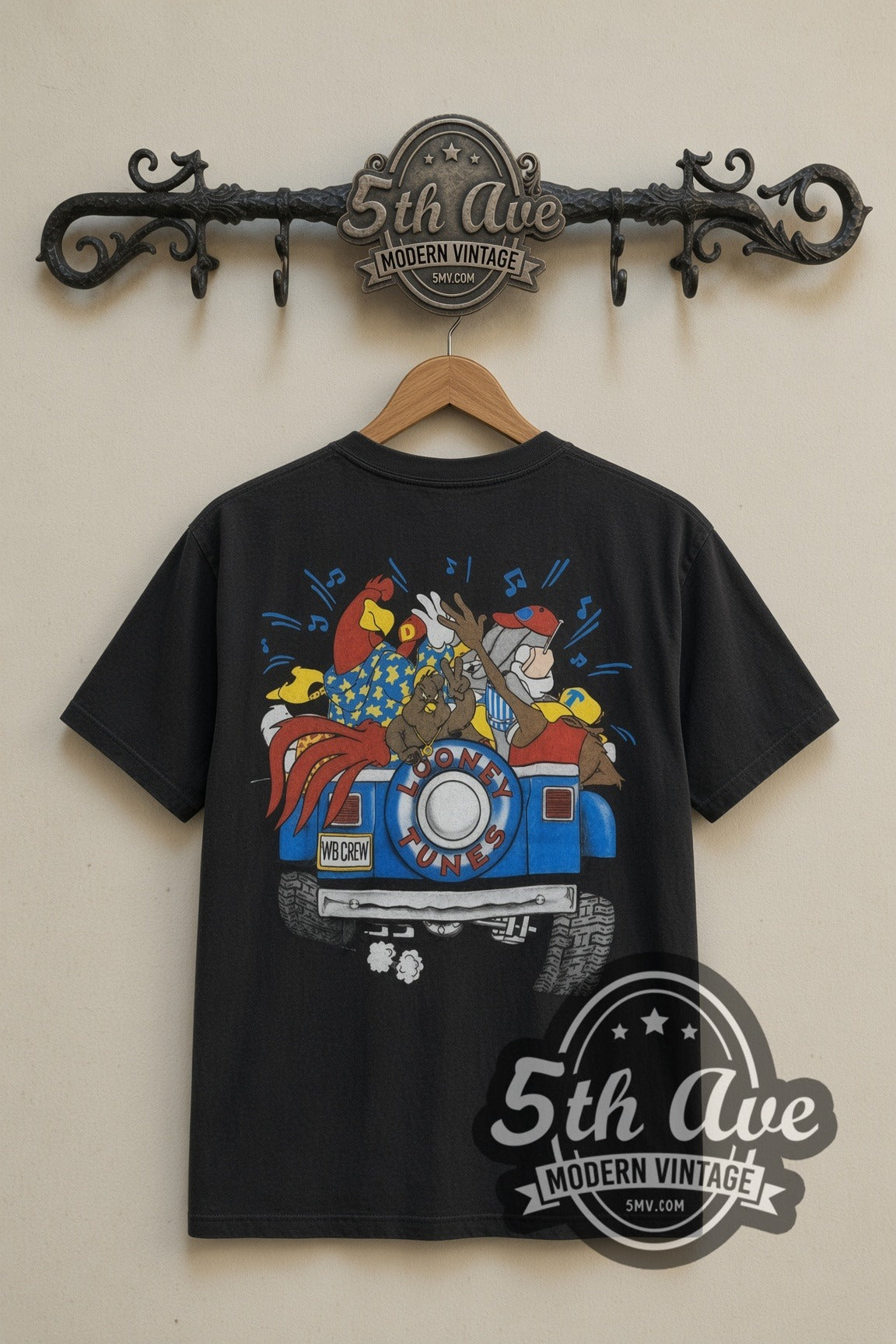 Looney Tunes Jeep Road Trip cartoon tee in black, back view on a display rack