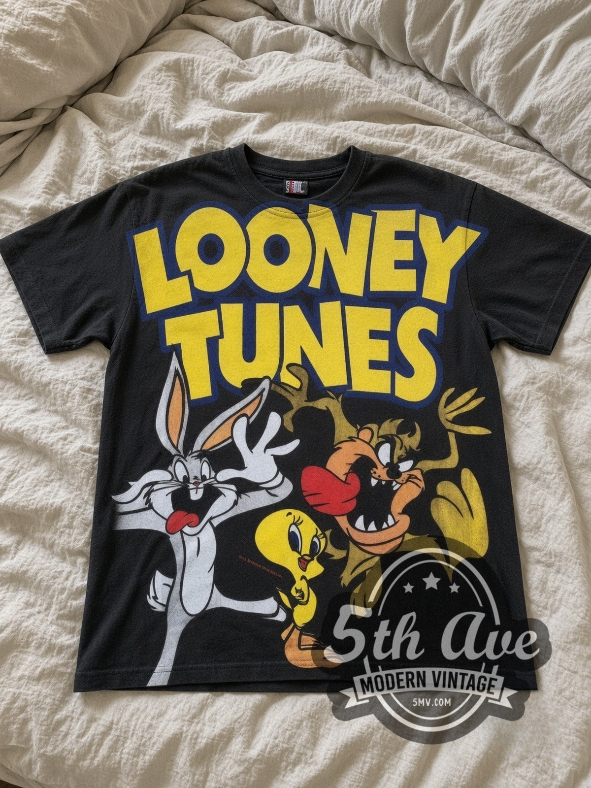 Looney Tunes Logo Bugs Tweety Taz Crew all-over-print vintage cartoon tee in black laid flat