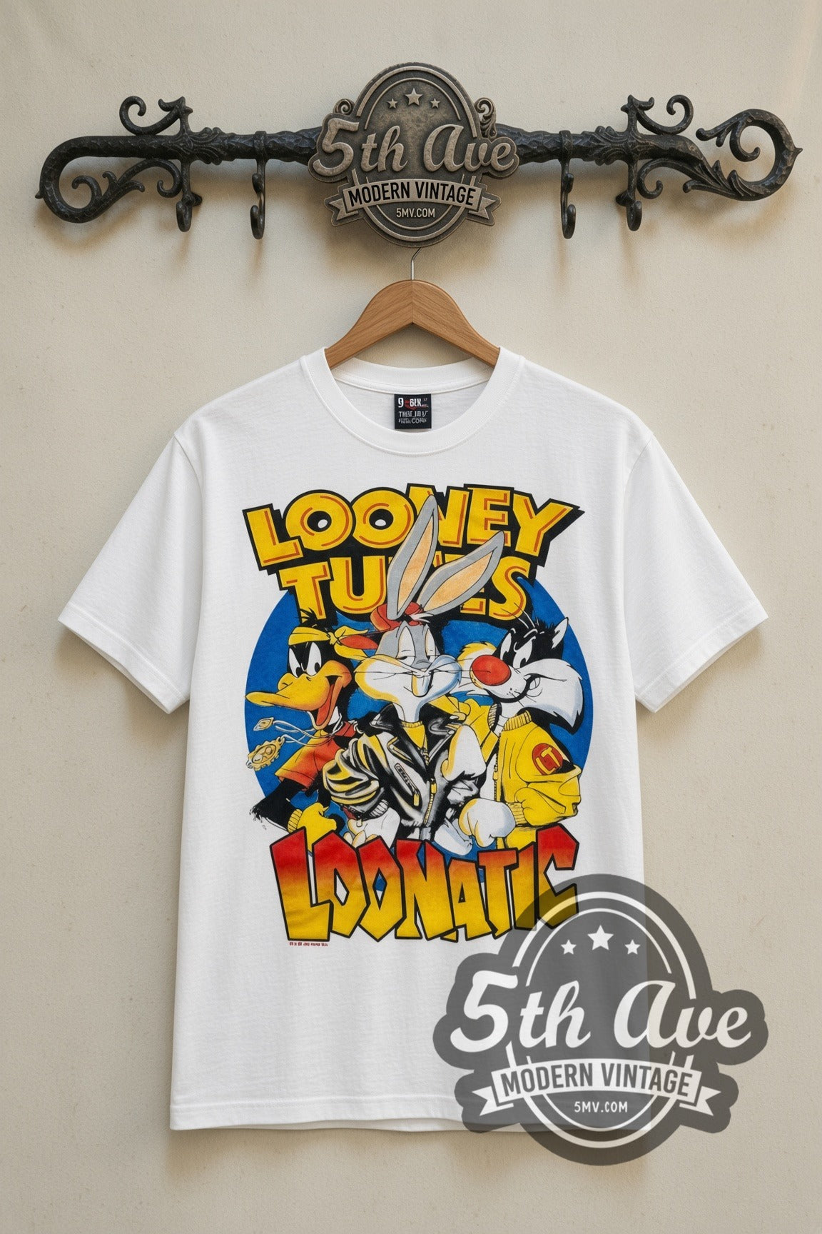 Looney Tunes Loonatic Biker Circle cartoon tee in white, front view on a display rack