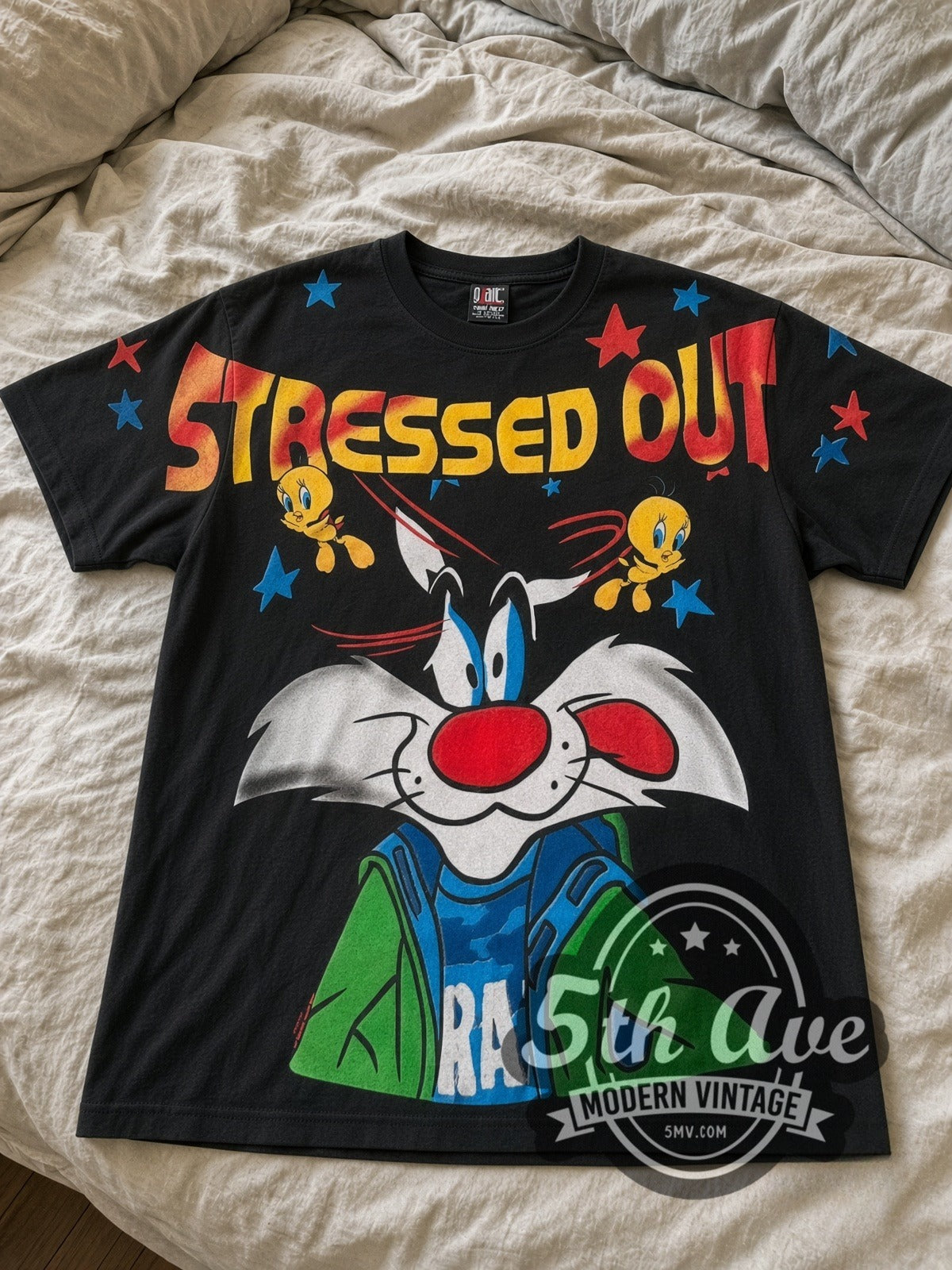 Looney Tunes Sylvester & Tweety Stressed Out all-over-print vintage cartoon tee in black laid flat