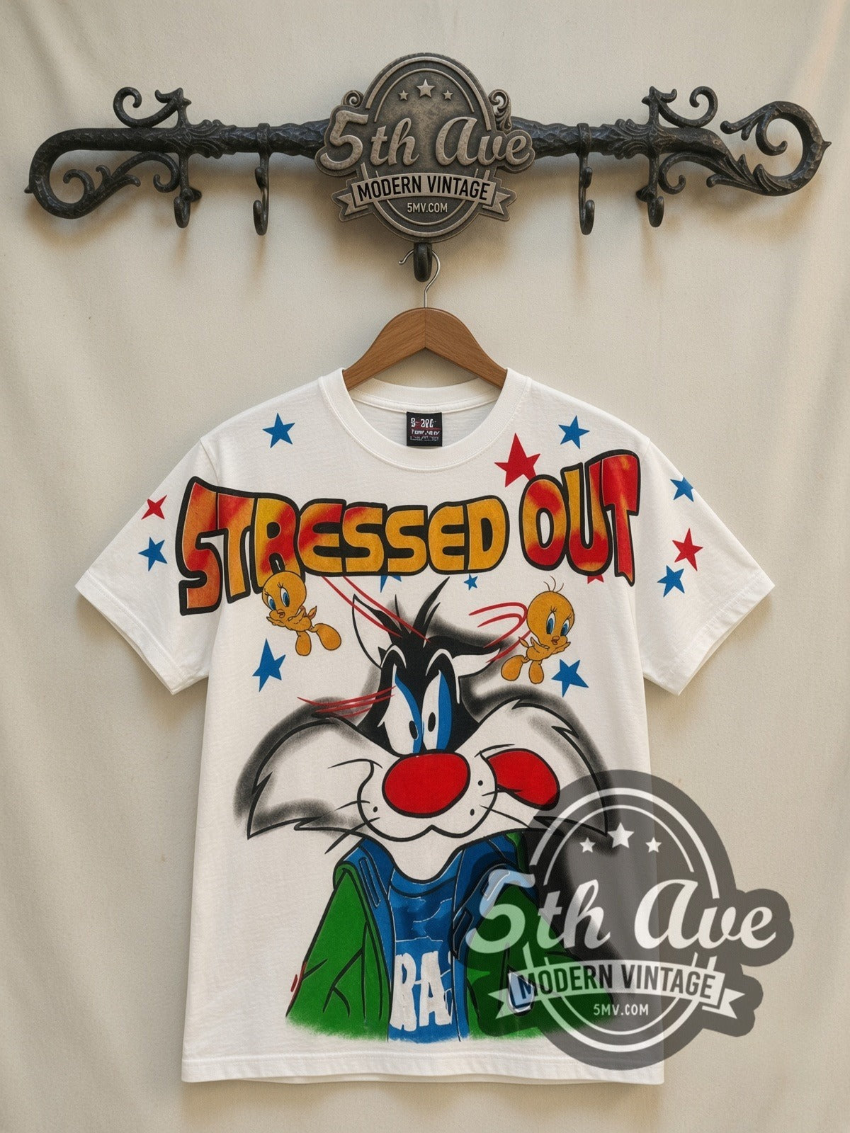 Looney Tunes Sylvester & Tweety Stressed Out all-over-print vintage cartoon t-shirt in white, front view on a display rack