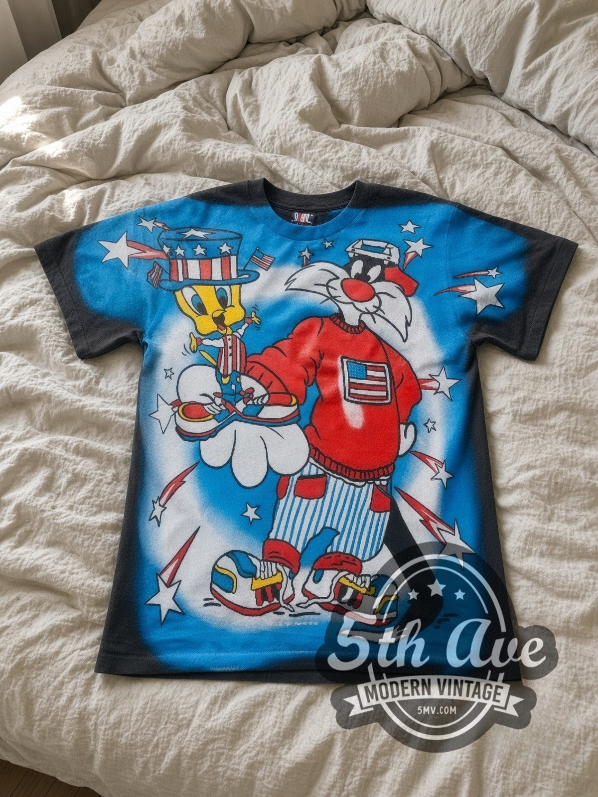 Looney Tunes Sylvester Uncle Sam Patriotic all-over-print vintage cartoon tee in blue laid flat