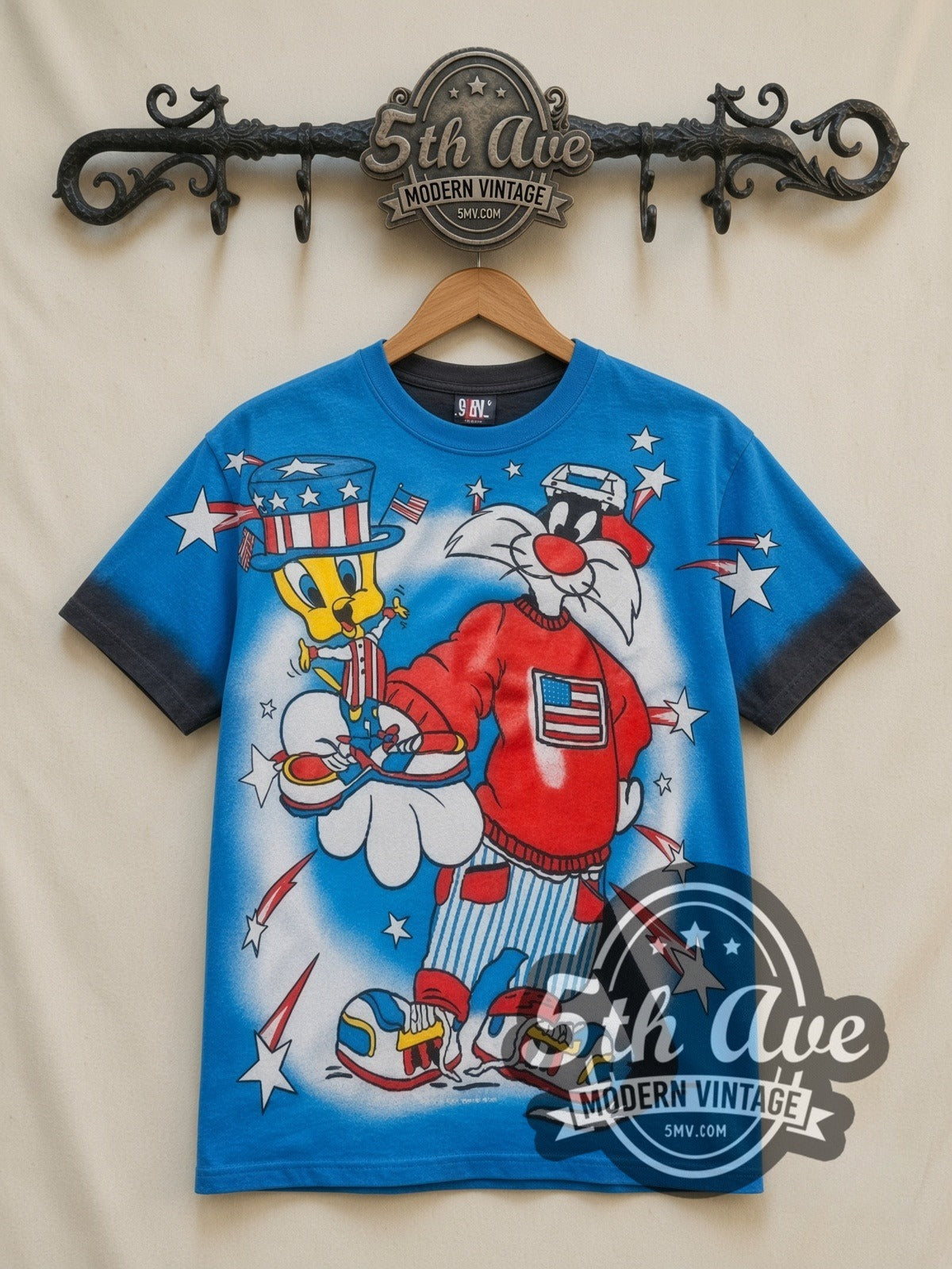 Looney Tunes Sylvester Uncle Sam Patriotic all-over-print vintage cartoon t-shirt in blue, front view on a display rack