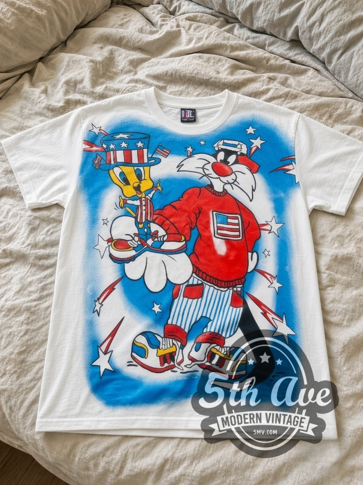 Looney Tunes Sylvester Uncle Sam Patriotic all-over-print vintage cartoon tee in white laid flat
