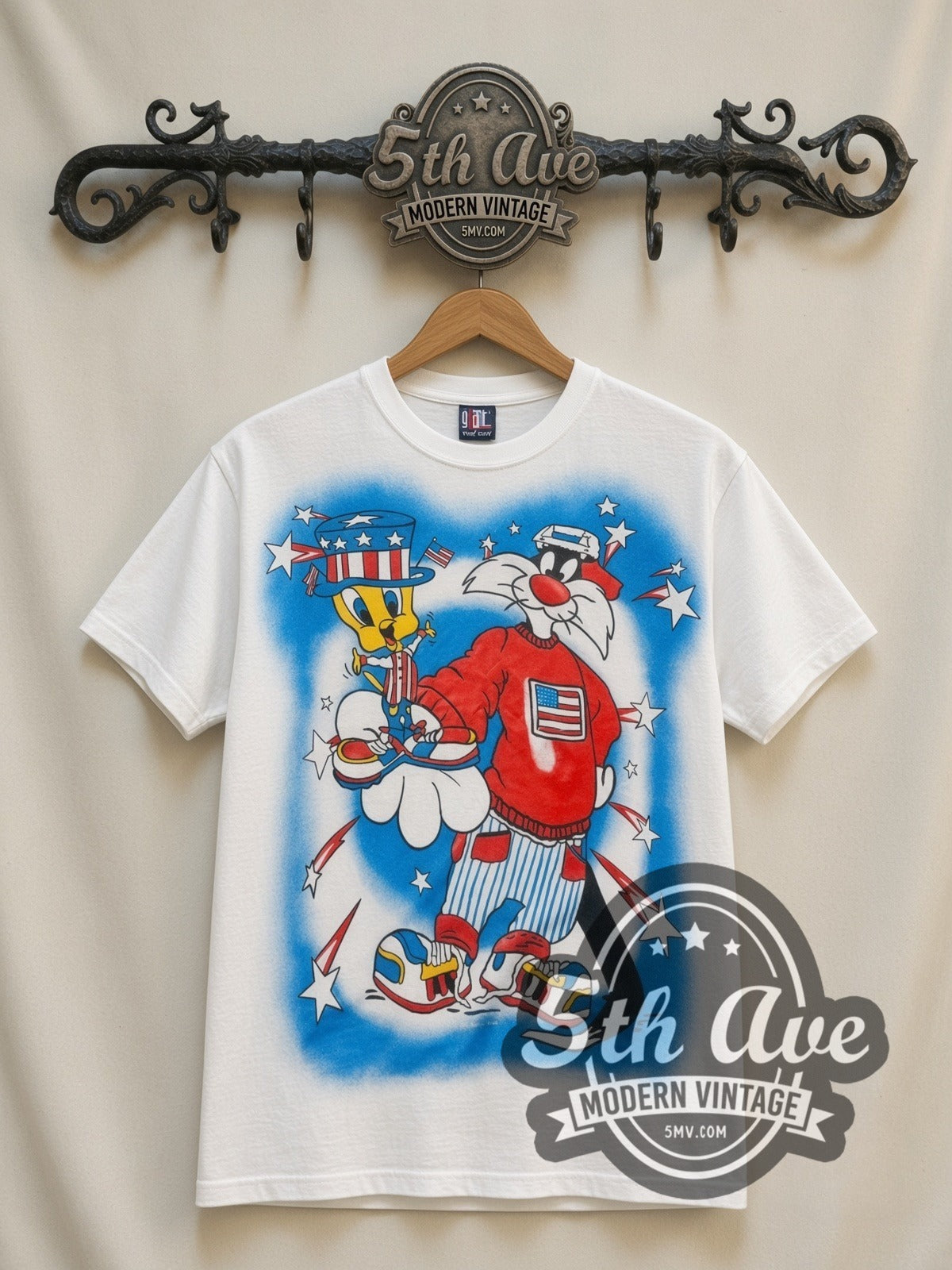 Looney Tunes Sylvester Uncle Sam Patriotic all-over-print vintage cartoon t-shirt in white, front view on a display rack