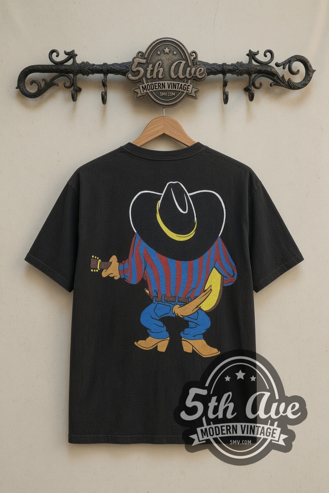 Looney Tunes Taz Cowboy Guitar Garth cartoon tee in black, back view on a display rack