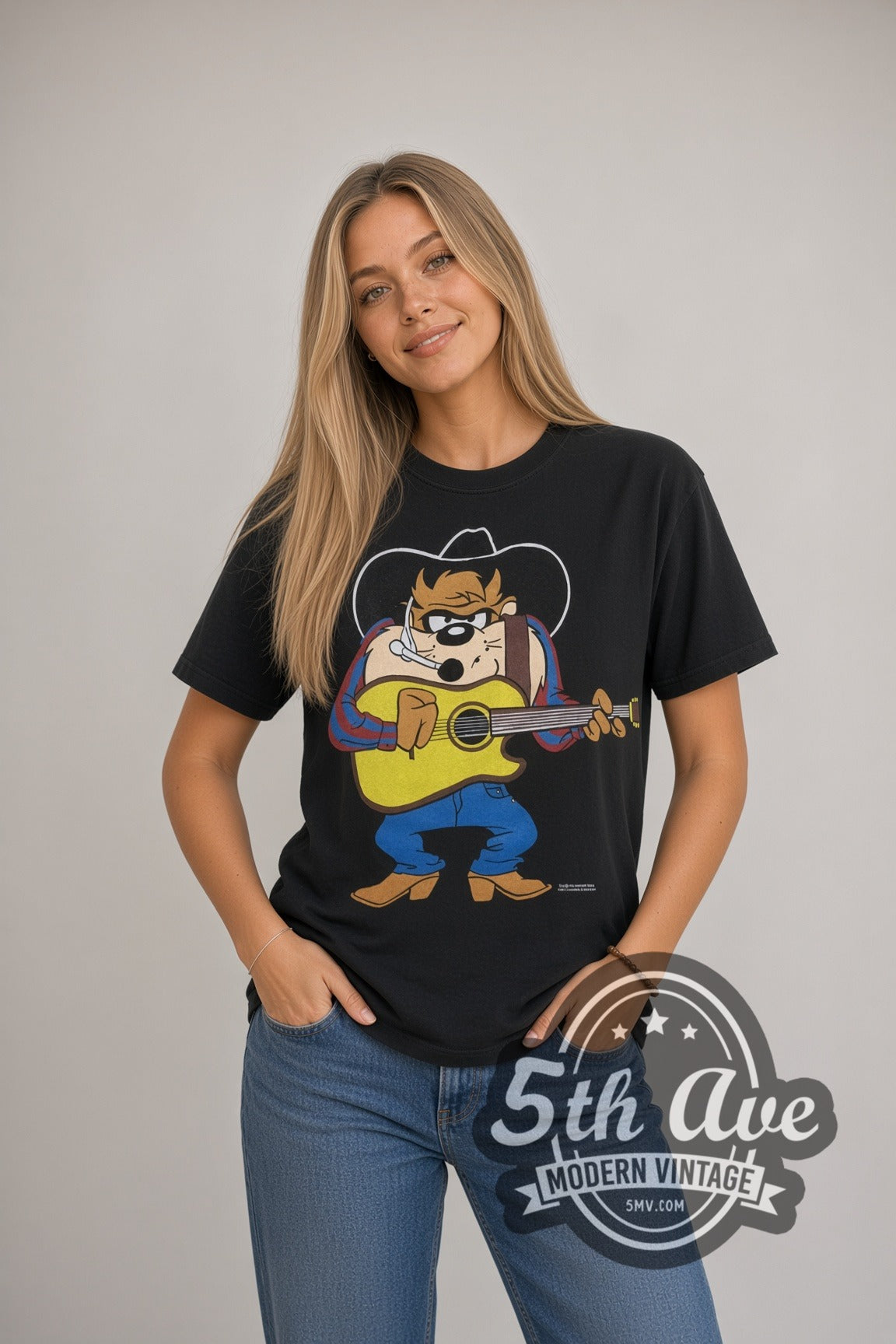 Model wearing the Looney Tunes Taz Cowboy Guitar Garth cartoon tee in black