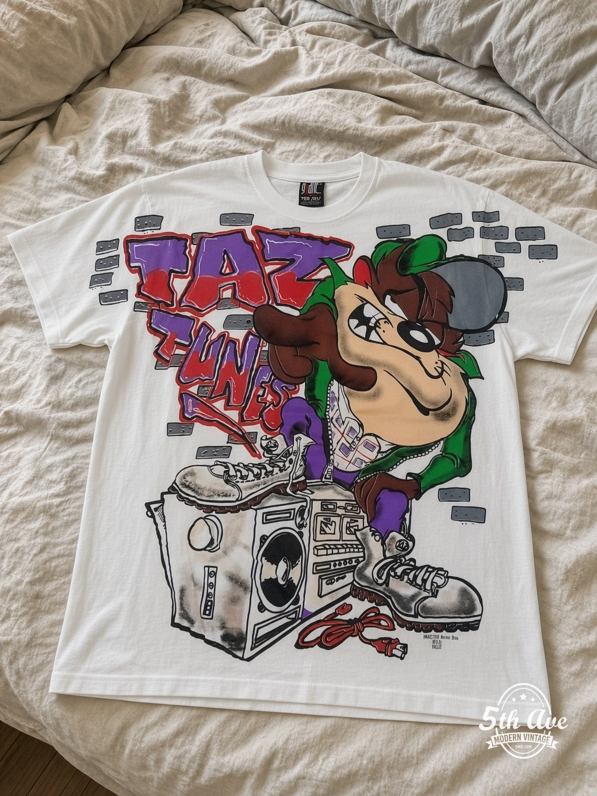 Looney Tunes Taz Funk Boombox vintage tee laid on bed