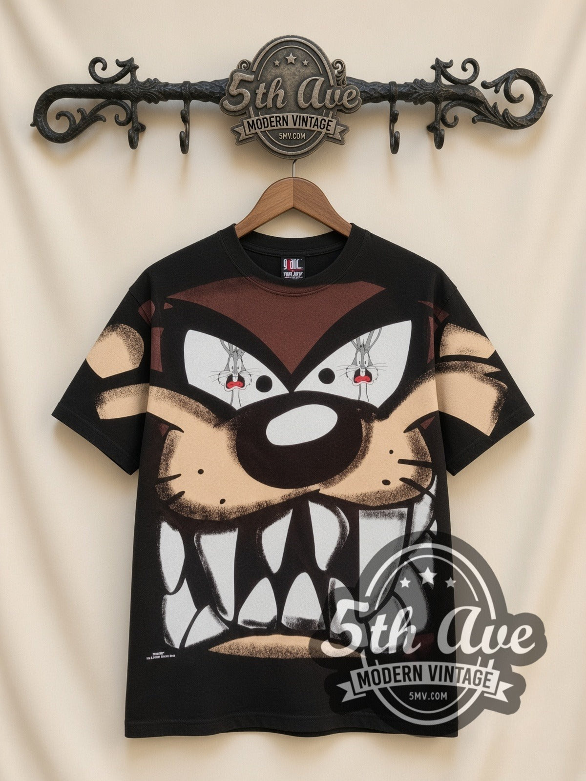 Looney Tunes Taz Giant Face Close-Up all-over-print vintage cartoon t-shirt, front view on a display rack