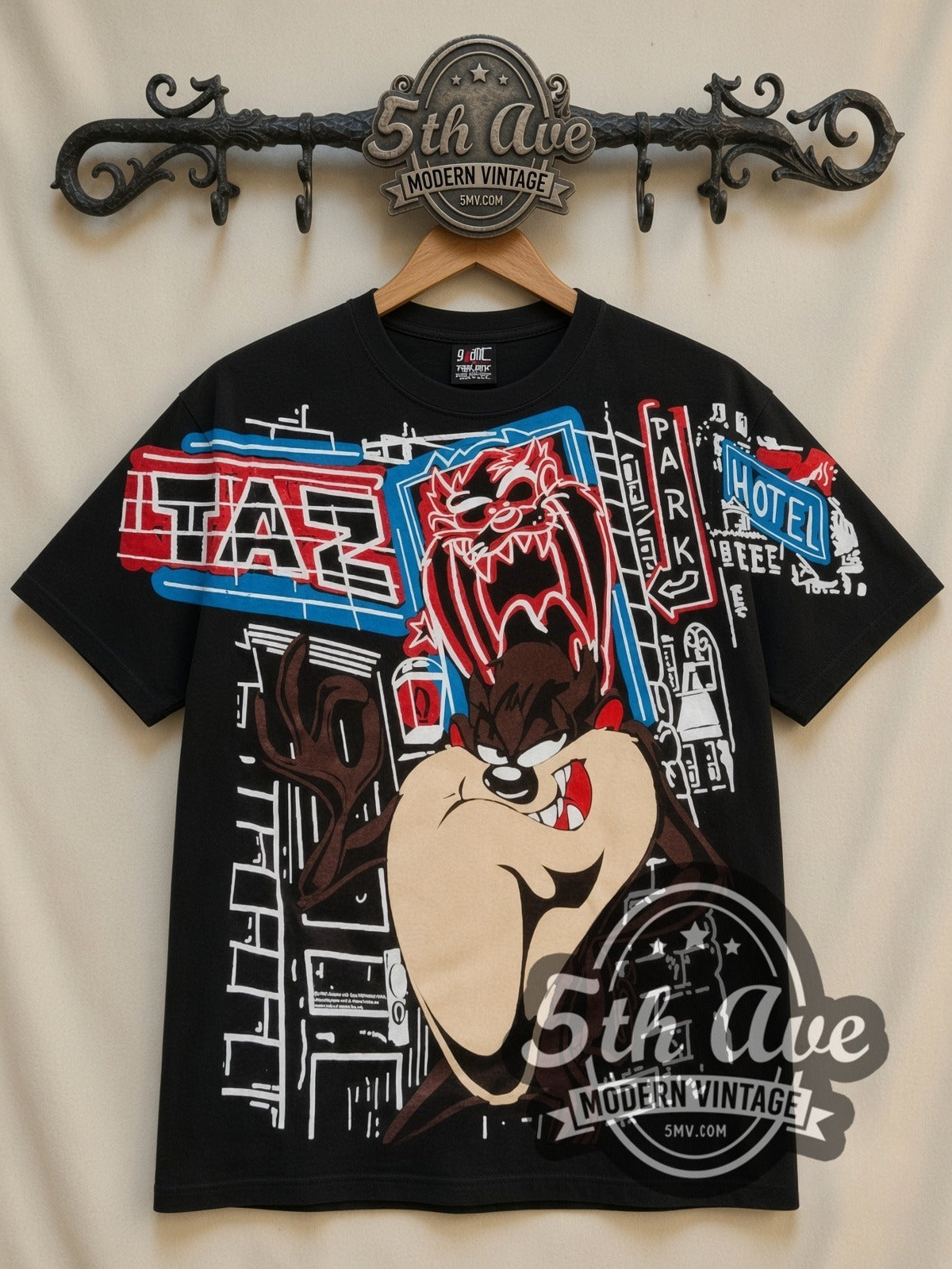 Looney Tunes Taz Graffiti Street all-over-print vintage cartoon t-shirt in black, front view on a display rack