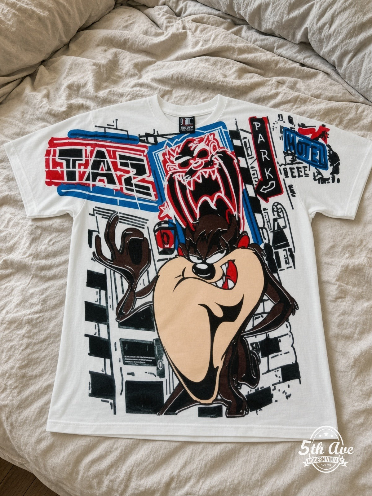 Looney Tunes Taz Graffiti Street vintage tee laid on bed