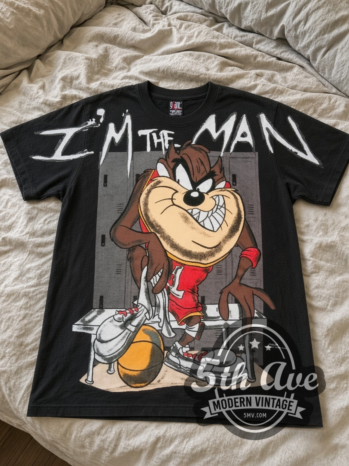 Looney Tunes Taz I'm The Man Basketball all-over-print vintage cartoon tee in black laid flat