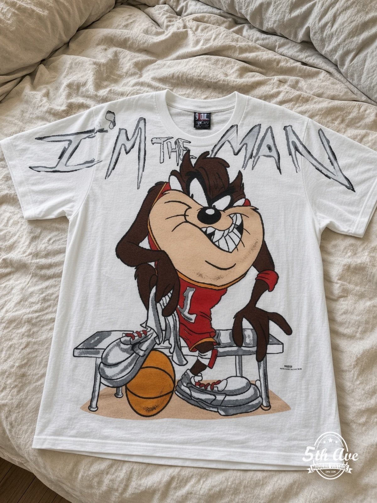 Looney Tunes Taz I'm The Man Basketball vintage tee laid on bed