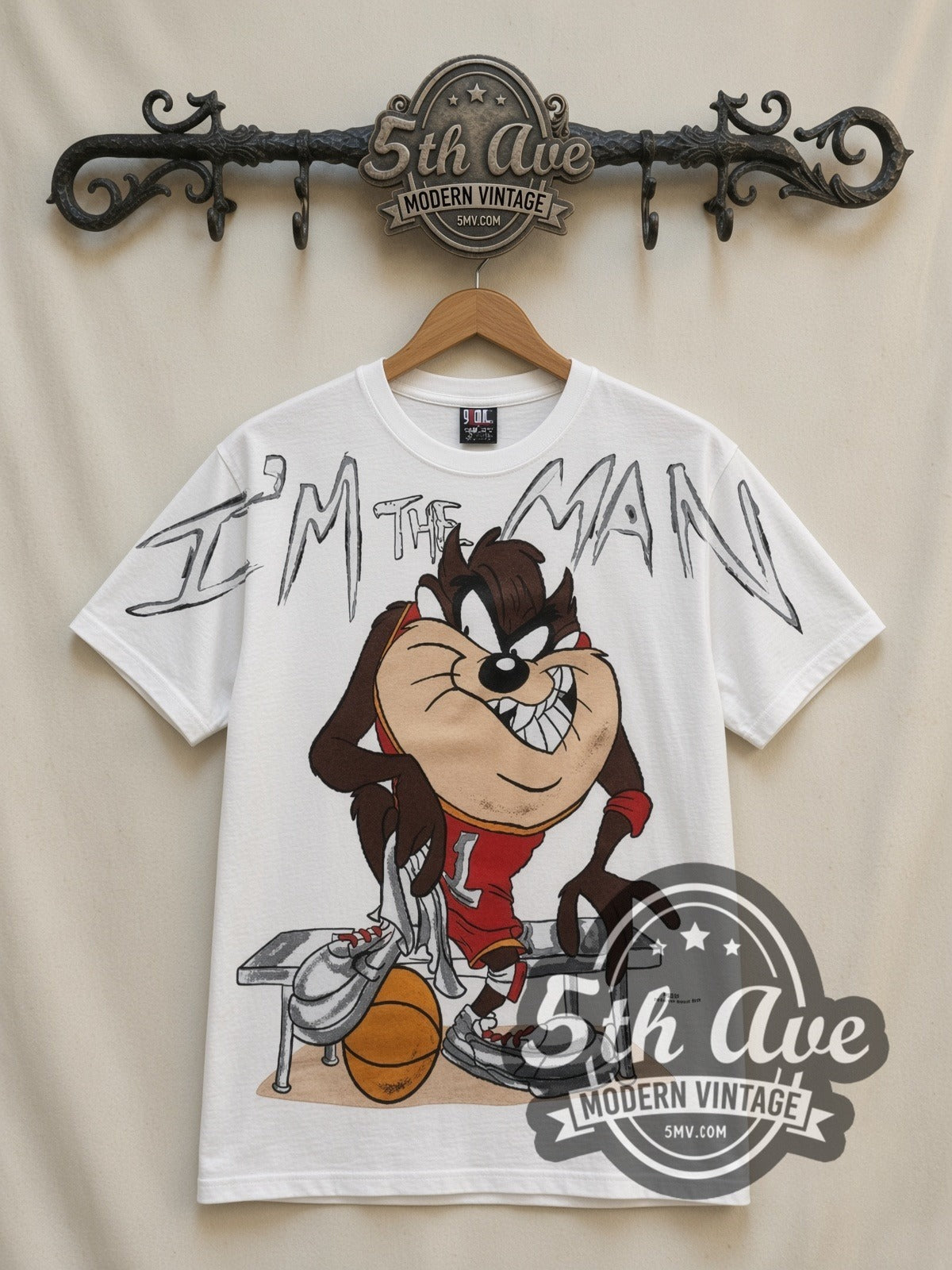 Looney Tunes Taz I'm The Man Basketball all-over-print vintage cartoon t-shirt in white, front view on a display rack