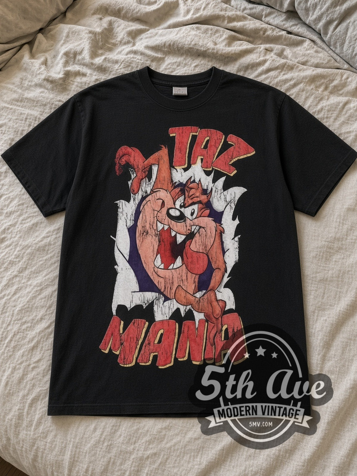 Black Looney Tunes Taz Mania Back Off Vintage Cartoon T-Shirt laid flat on a linen bed