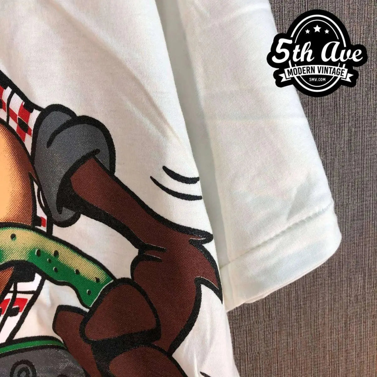 Model wearing Looney Tunes – Taz Truckin Company – New Vintage Graphic Tee vintage band tee