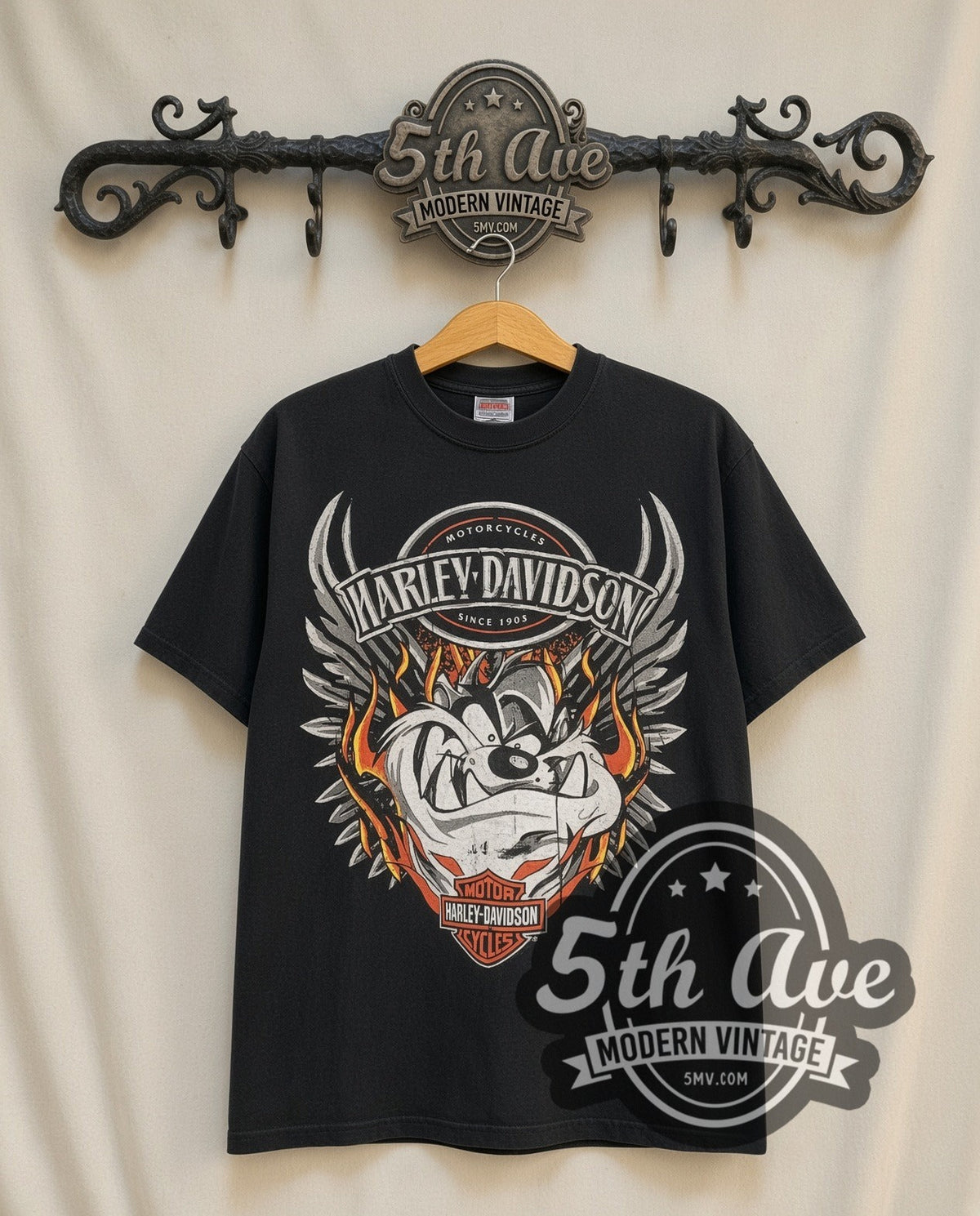 Harley-Davidson Taz Wings Flames Live Hard Be Free vintage Harley tee in black, front view on a display rack