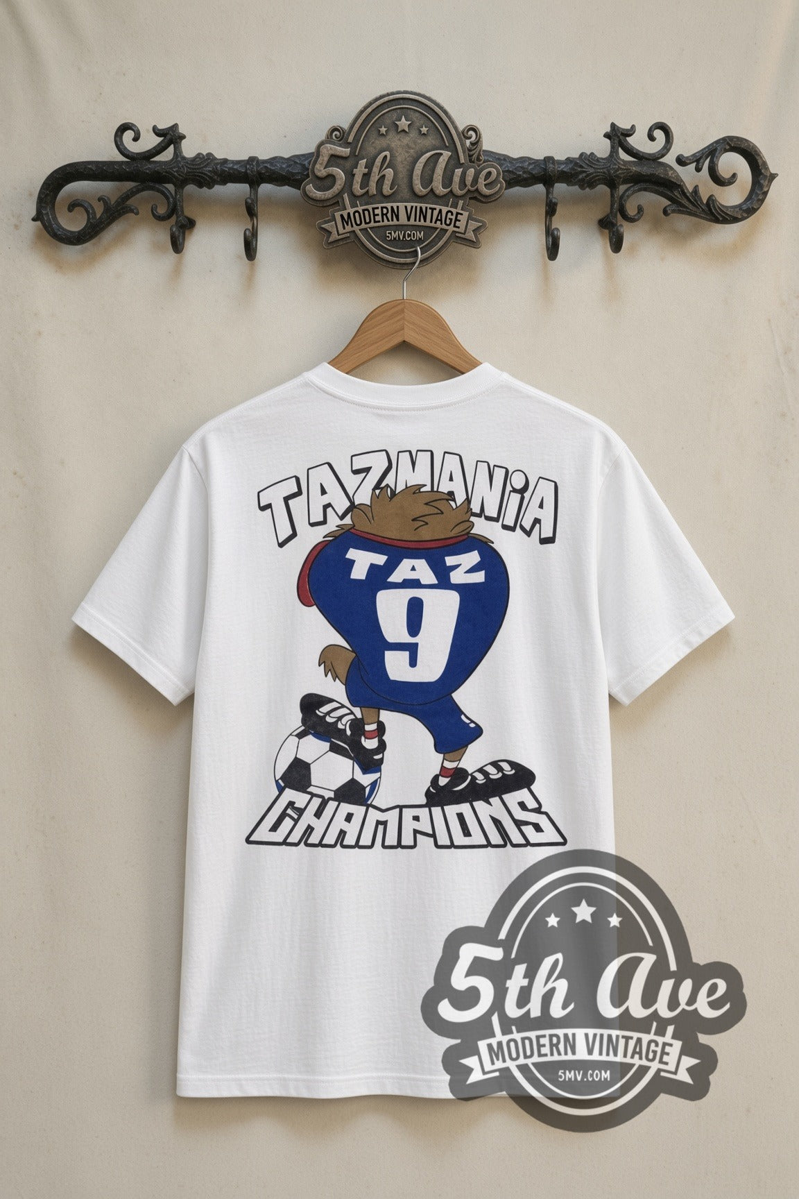 Looney Tunes Taz Soccer Champions cartoon tee in white, back view on a display rack