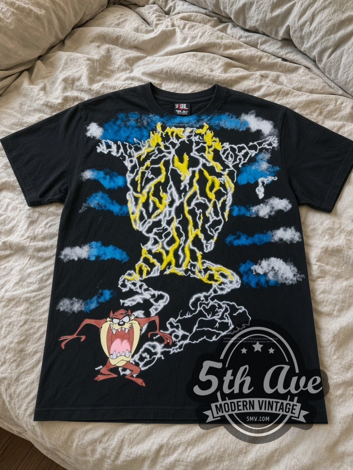 Looney Tunes Taz Tornado Lightning all-over-print vintage cartoon tee laid flat