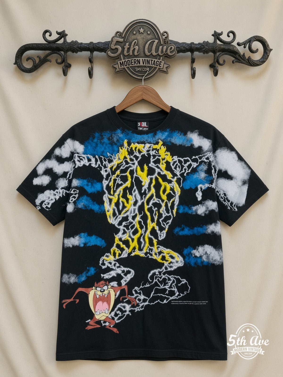 Looney Tunes Taz Tornado Lightning all over print vintage cartoon t-shirt front on cream 5th Ave rack
