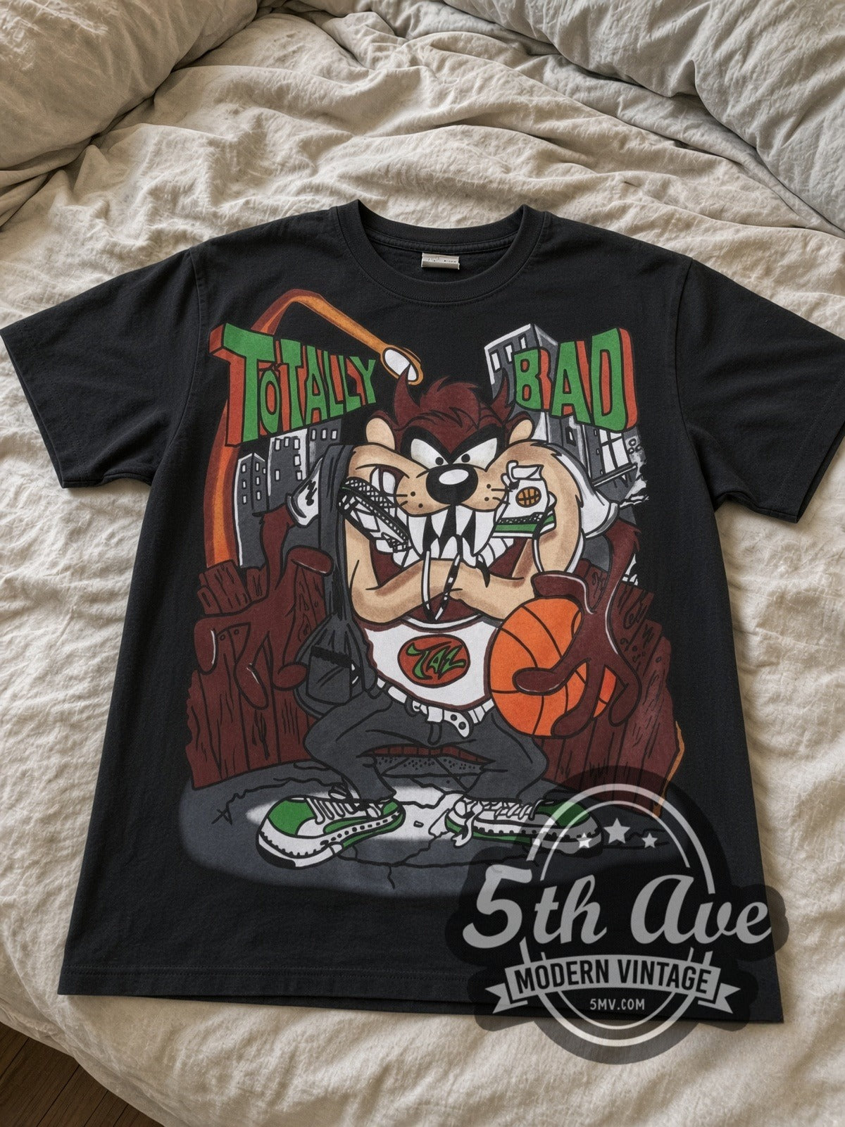 Looney Tunes Taz Totally Bad all-over-print vintage cartoon tee in black laid flat