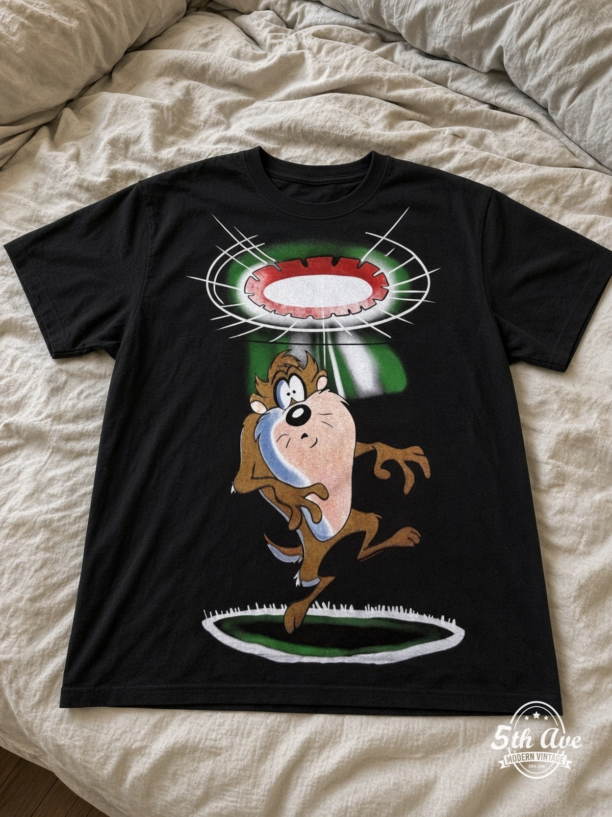 Looney Tunes Taz UFO Abduction vintage tee laid on bed