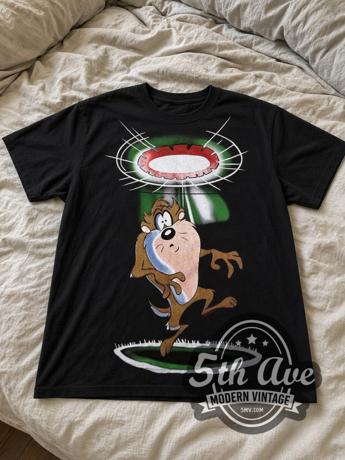 Looney Tunes Taz UFO Abduction all-over-print vintage cartoon tee in black laid flat