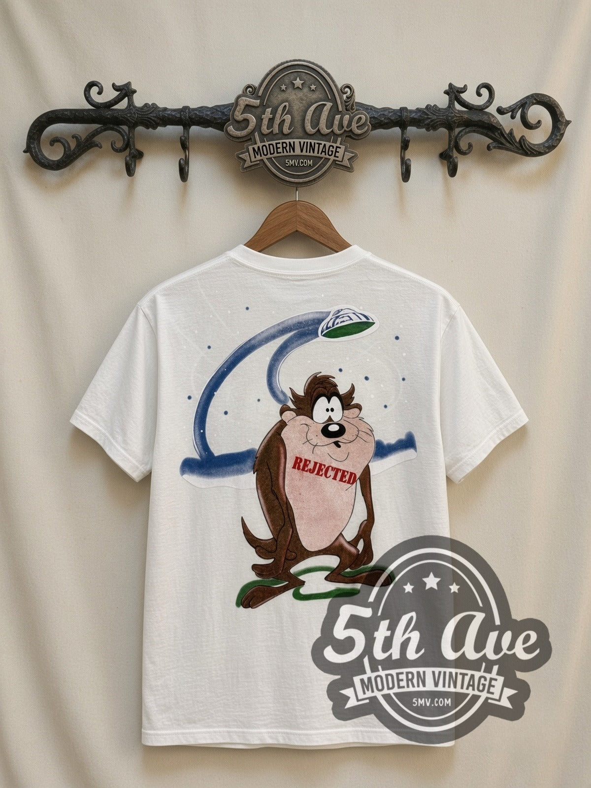 Looney Tunes Taz UFO Abduction all-over-print vintage cartoon t-shirt in white, back view on a display rack