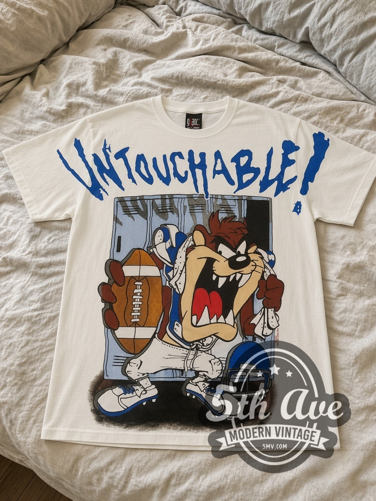 Looney Tunes Taz Untouchable Football all-over-print vintage cartoon tee in white laid flat
