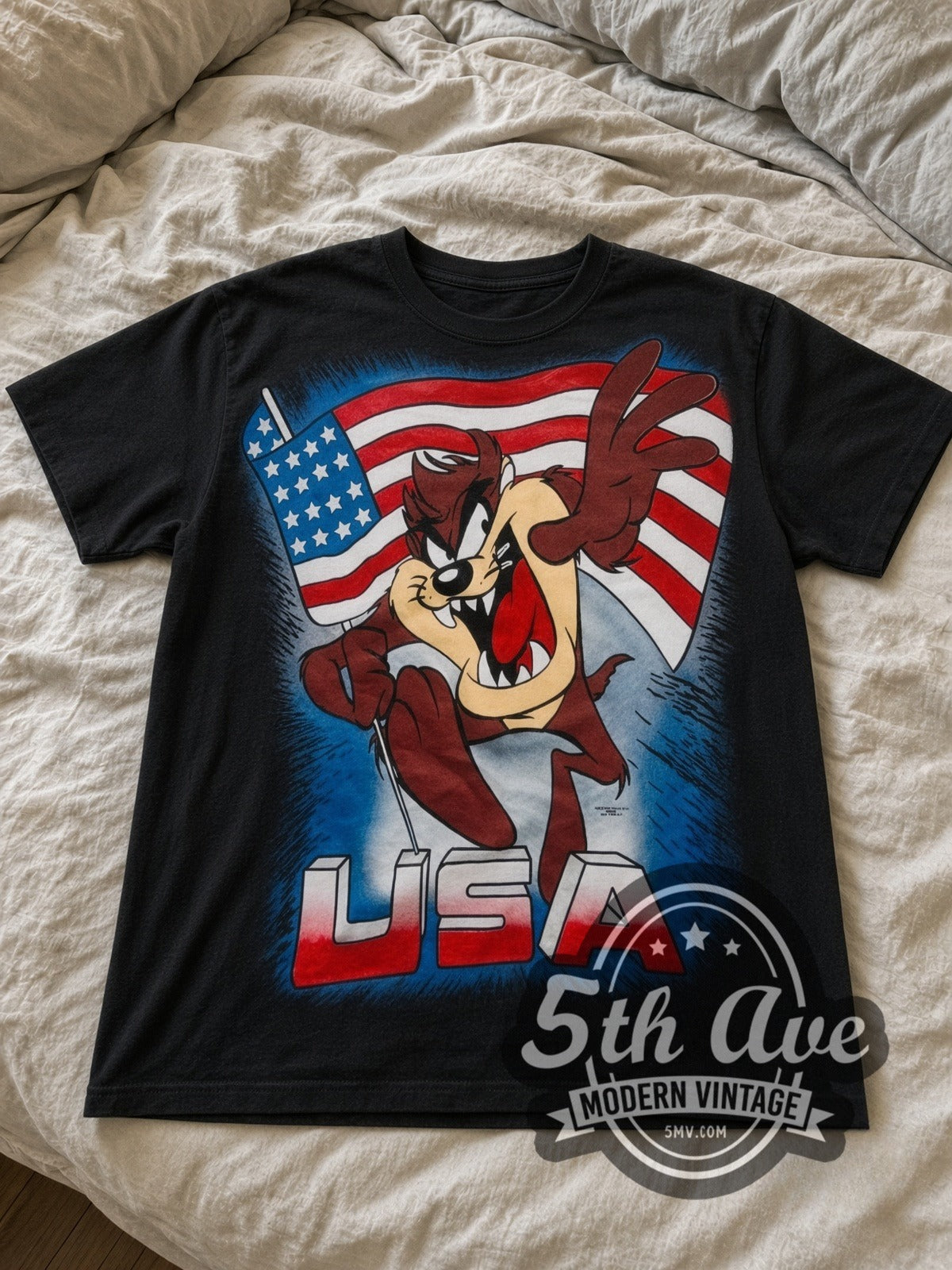 Looney Tunes Taz USA Flag all-over-print vintage cartoon tee in black laid flat