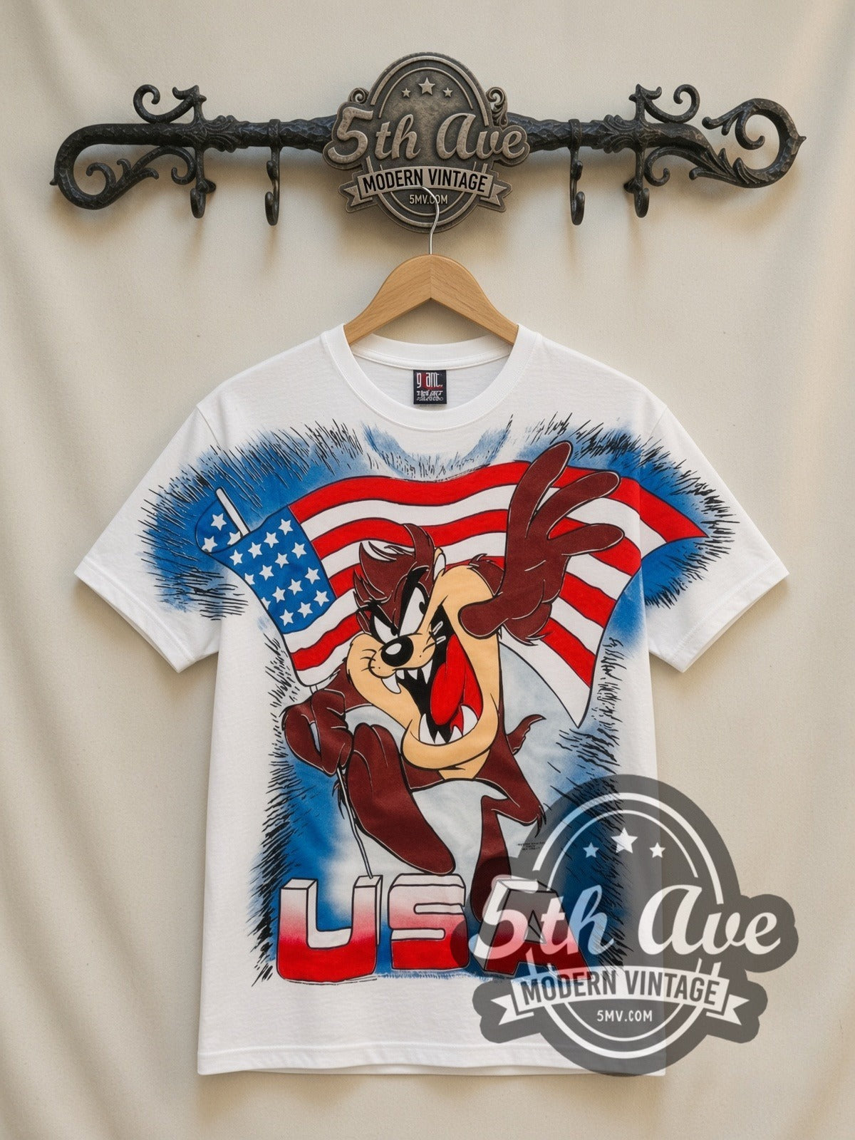 Looney Tunes Taz USA Flag all-over-print vintage cartoon t-shirt in white, front view on a display rack