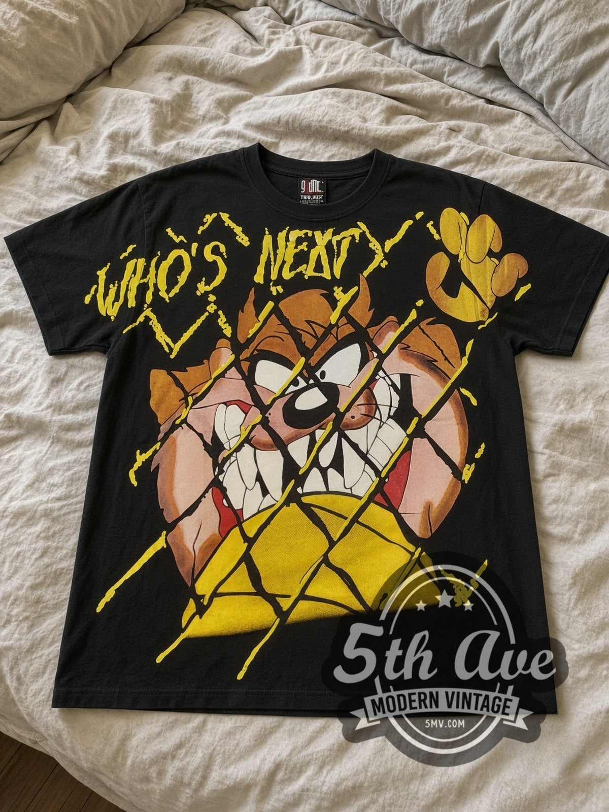 Looney Tunes Taz Who's Next all-over-print vintage cartoon tee in black laid flat