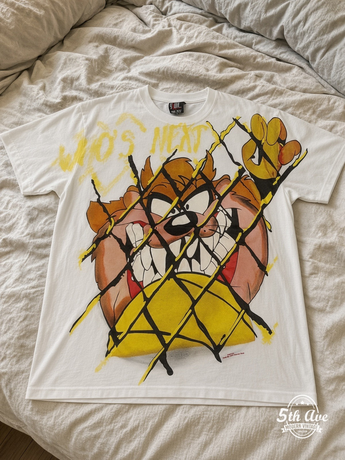 Looney Tunes Taz Who's Next vintage tee laid on bed