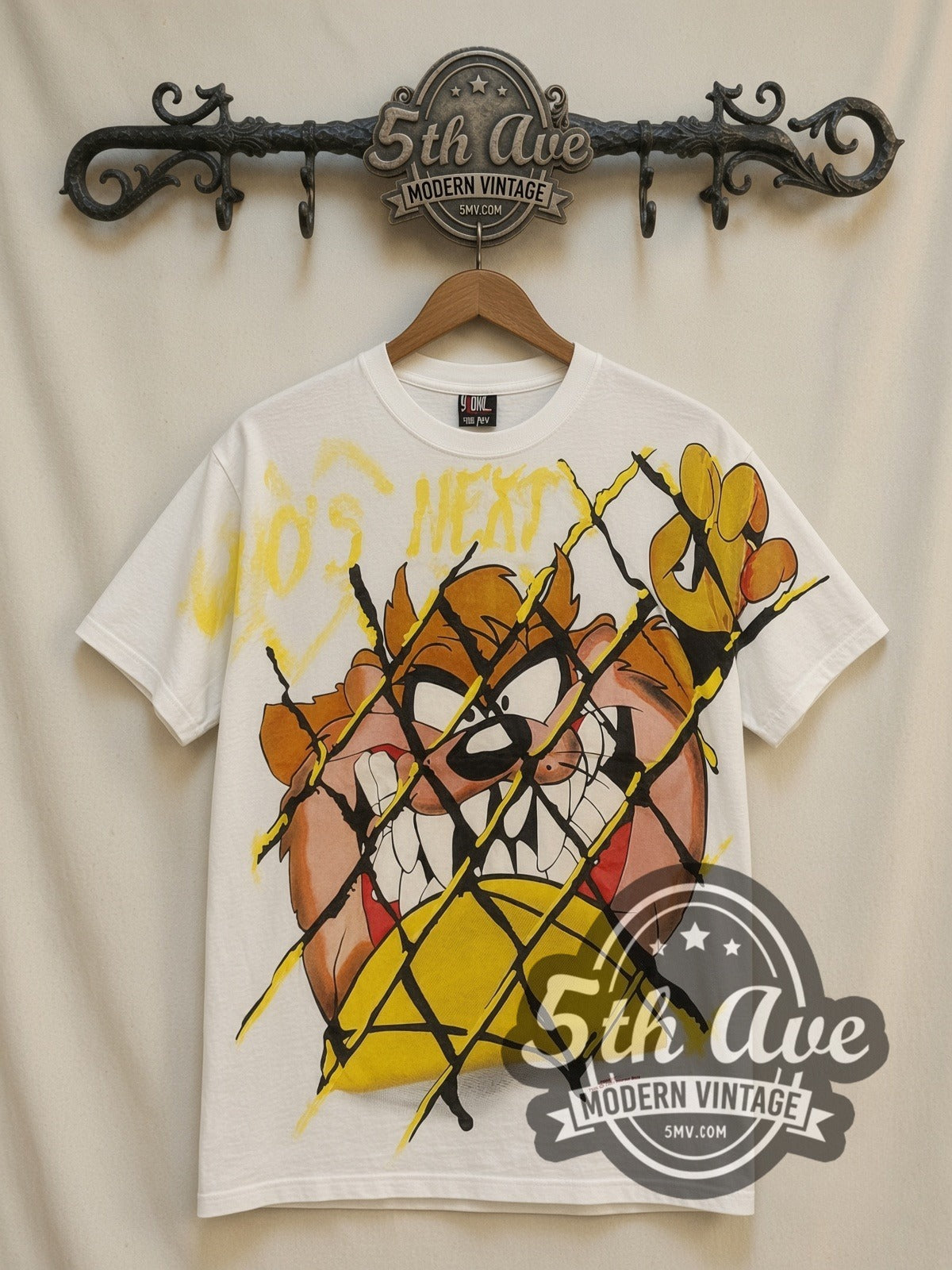 Looney Tunes Taz Who's Next all-over-print vintage cartoon t-shirt in white, front view on a display rack