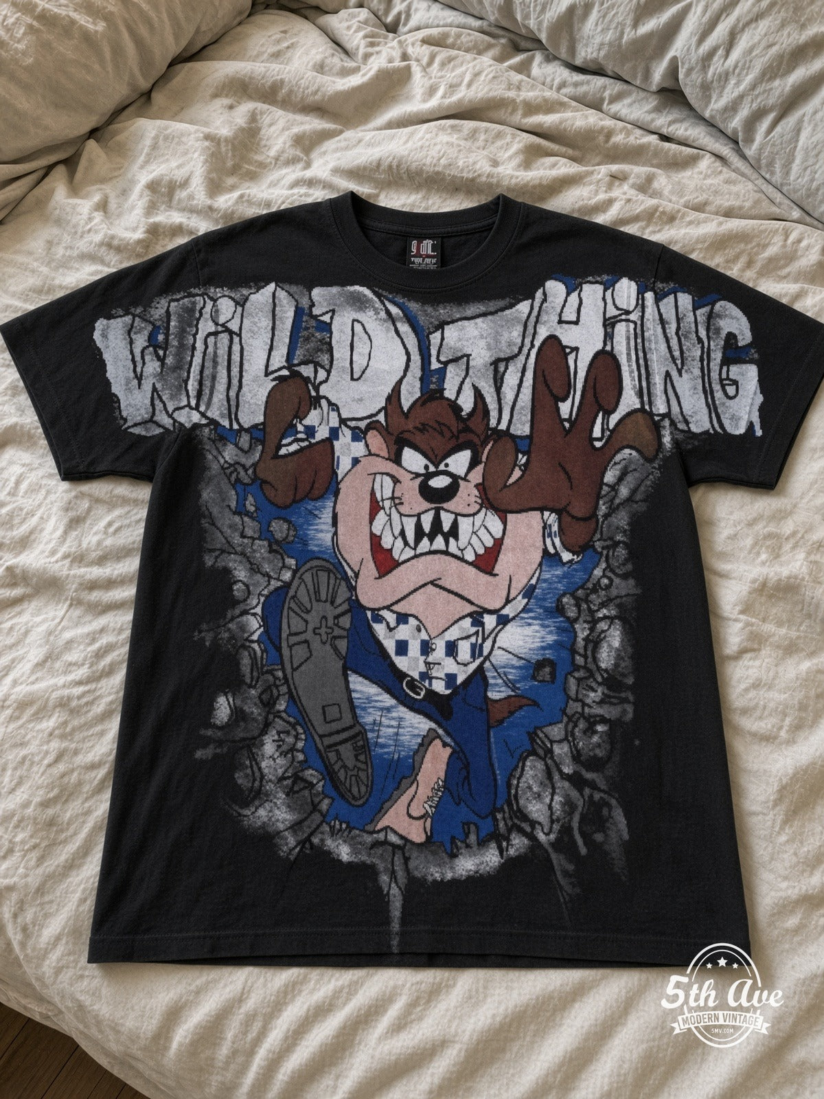 Looney Tunes Taz Wild Thing vintage tee laid on bed