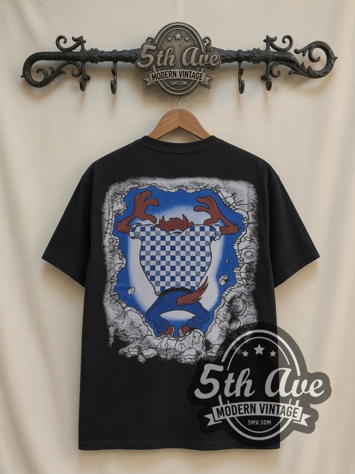 Looney Tunes Taz Wild Thing all-over-print vintage cartoon t-shirt in black, back view on a display rack