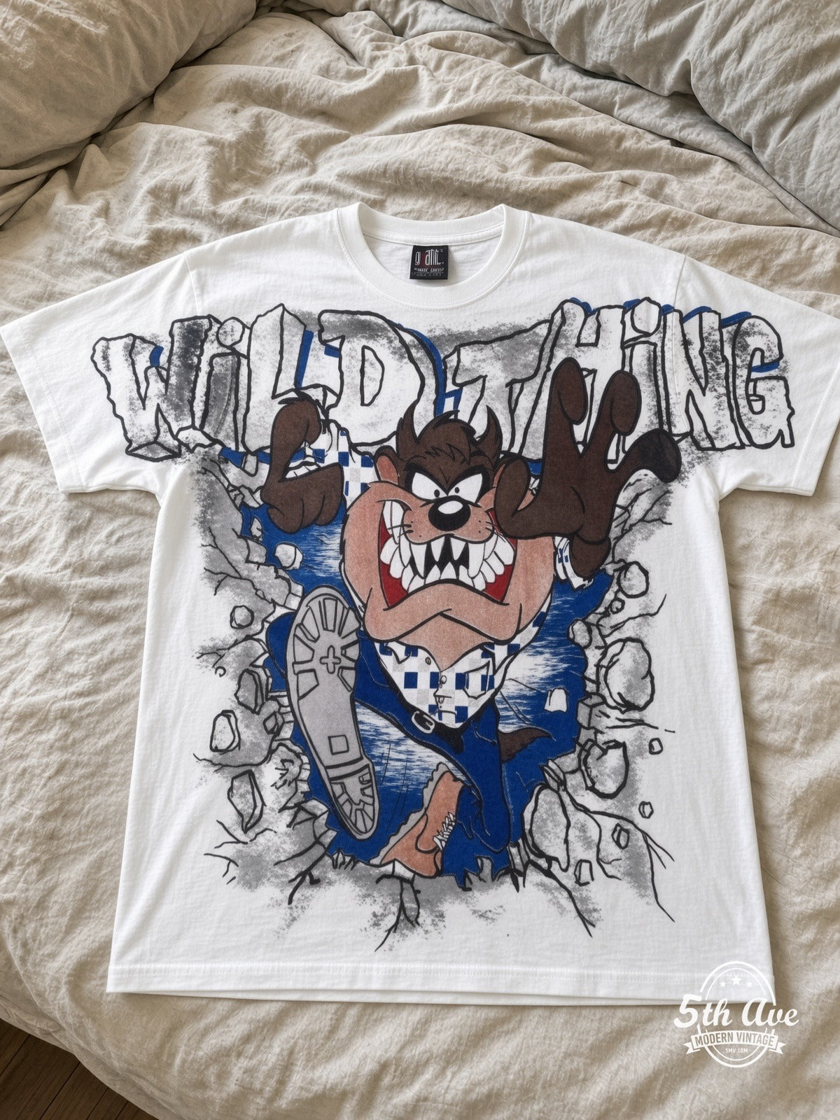 Looney Tunes Taz Wild Thing vintage tee laid on bed