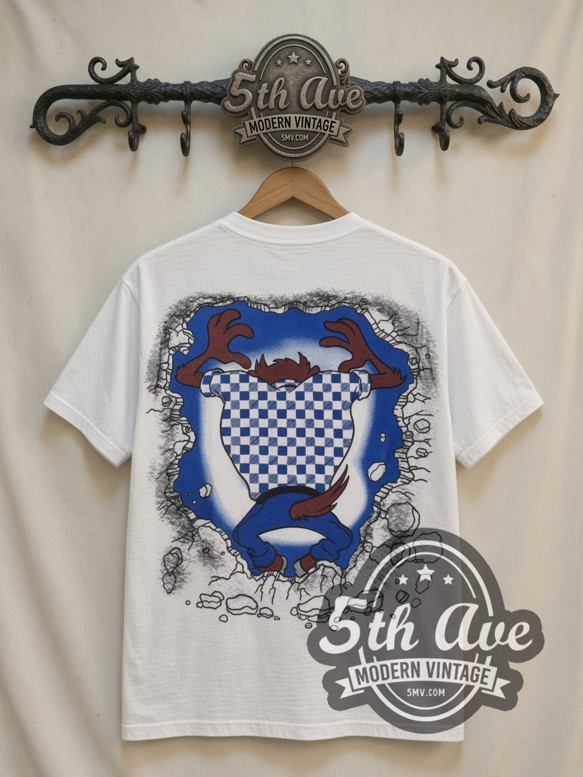 Looney Tunes Taz Wild Thing all-over-print vintage cartoon t-shirt in white, back view on a display rack