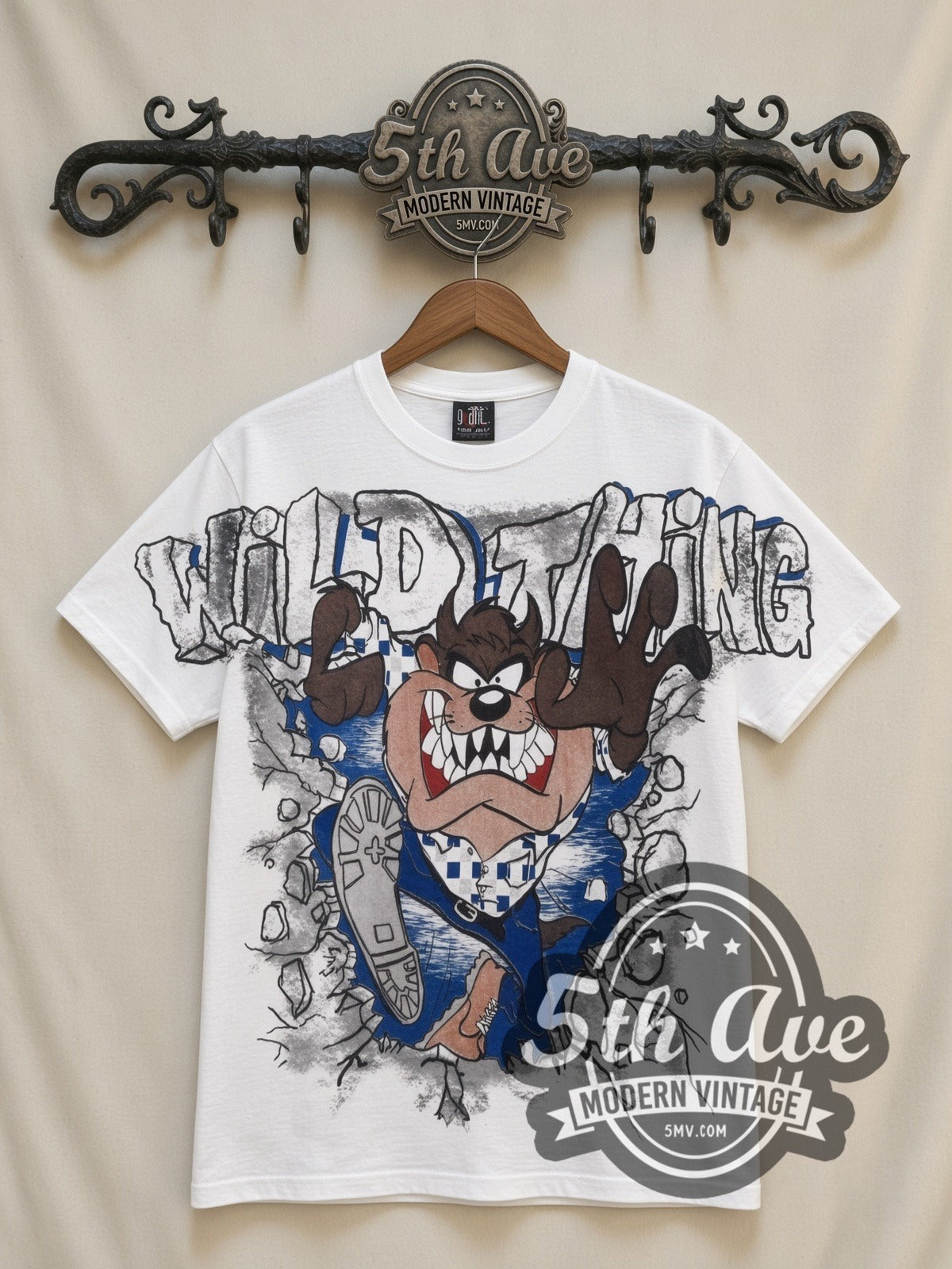 Looney Tunes Taz Wild Thing all-over-print vintage cartoon t-shirt in white, front view on a display rack