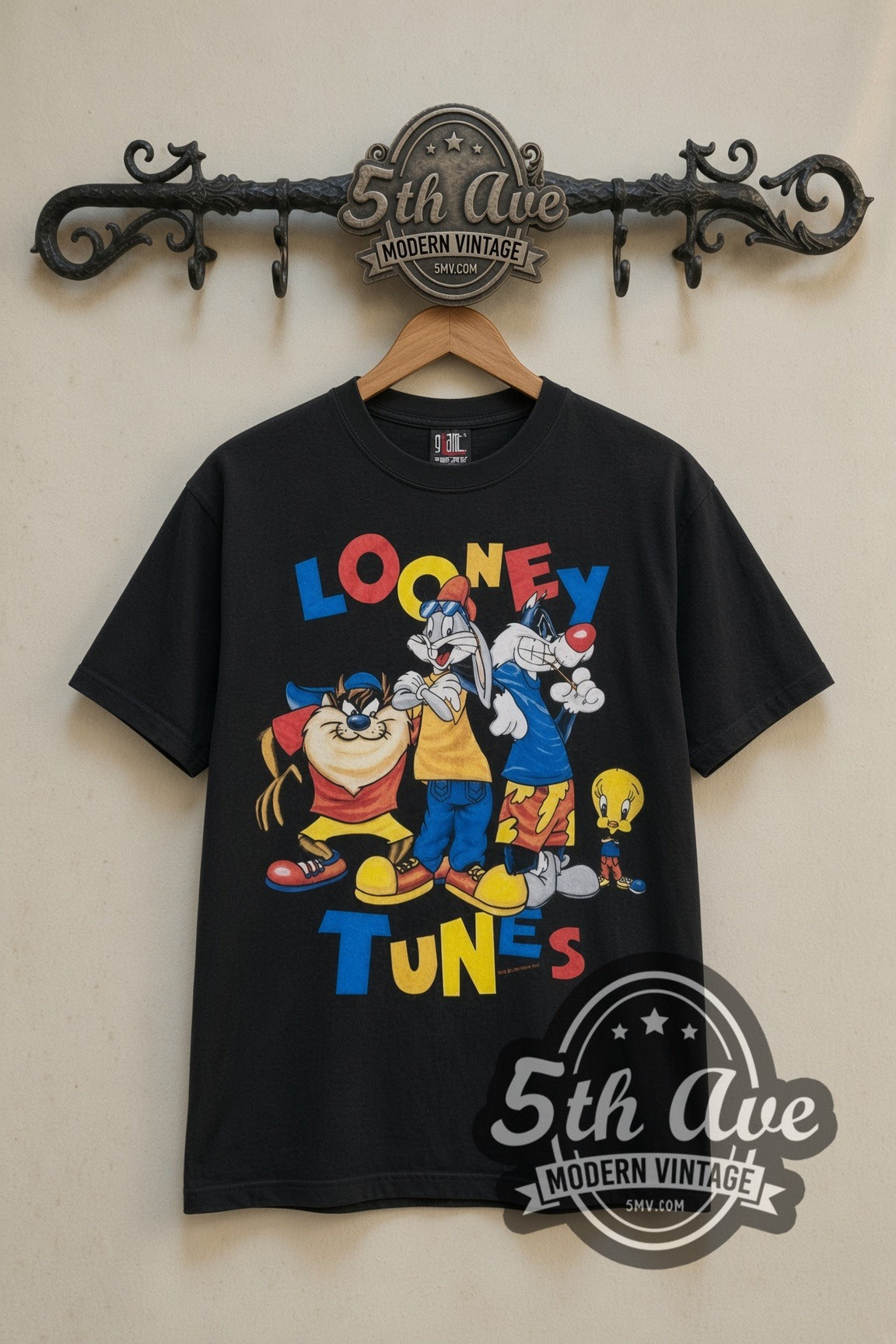 Looney Tunes Tune Squad Group cartoon tee in black, front view on a display rack