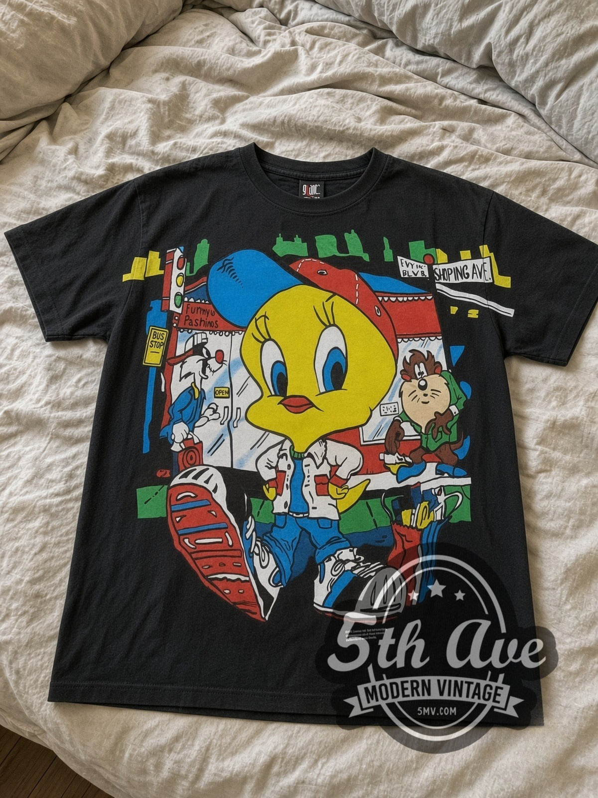 Looney Tunes Tweety Streetwear City all-over-print vintage cartoon tee in black laid flat